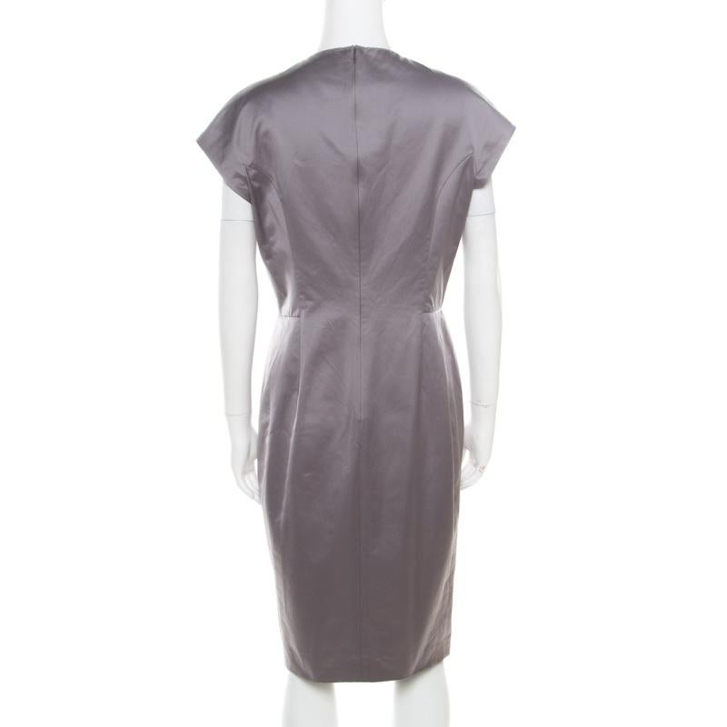 Simple, sophisticated and very stylish, this YSL dress will help you ace a contemporary look and fetch admiration from one and all! The grey creation is made of a cotton blend and features a flattering feminine silhouette. It flaunts a plunging