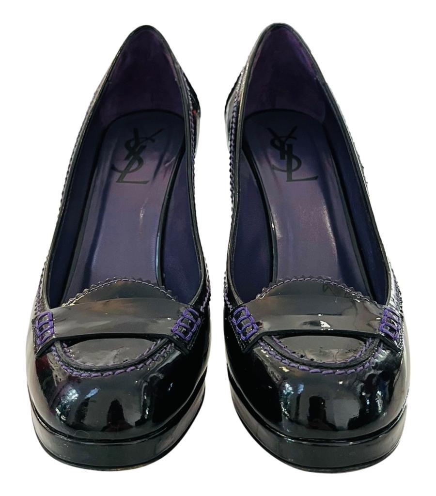 Yves Saint Laurent Patent Leather Loafer Heels

Black platform pumps designed with round, loafer-inspired toe with contrasting purple stitching detail.

Featuring high stiletto heel and leather insoles.

Size – 38.5

Condition – Very Good (Minor
