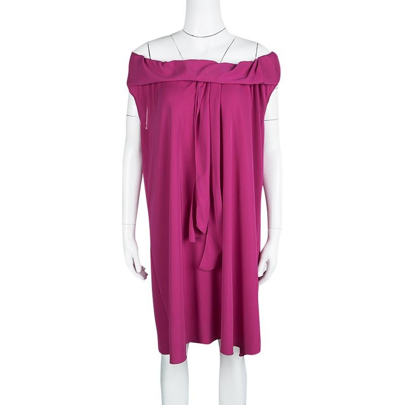 All this luxurious dress by Yves Saint Laurent needs is to attend a party and to descend down a staircase, and make sure all eyes are on you. This gorgeous dress features a knitted off-shoulder. Wear it with a beautiful pair of matching stilettos as