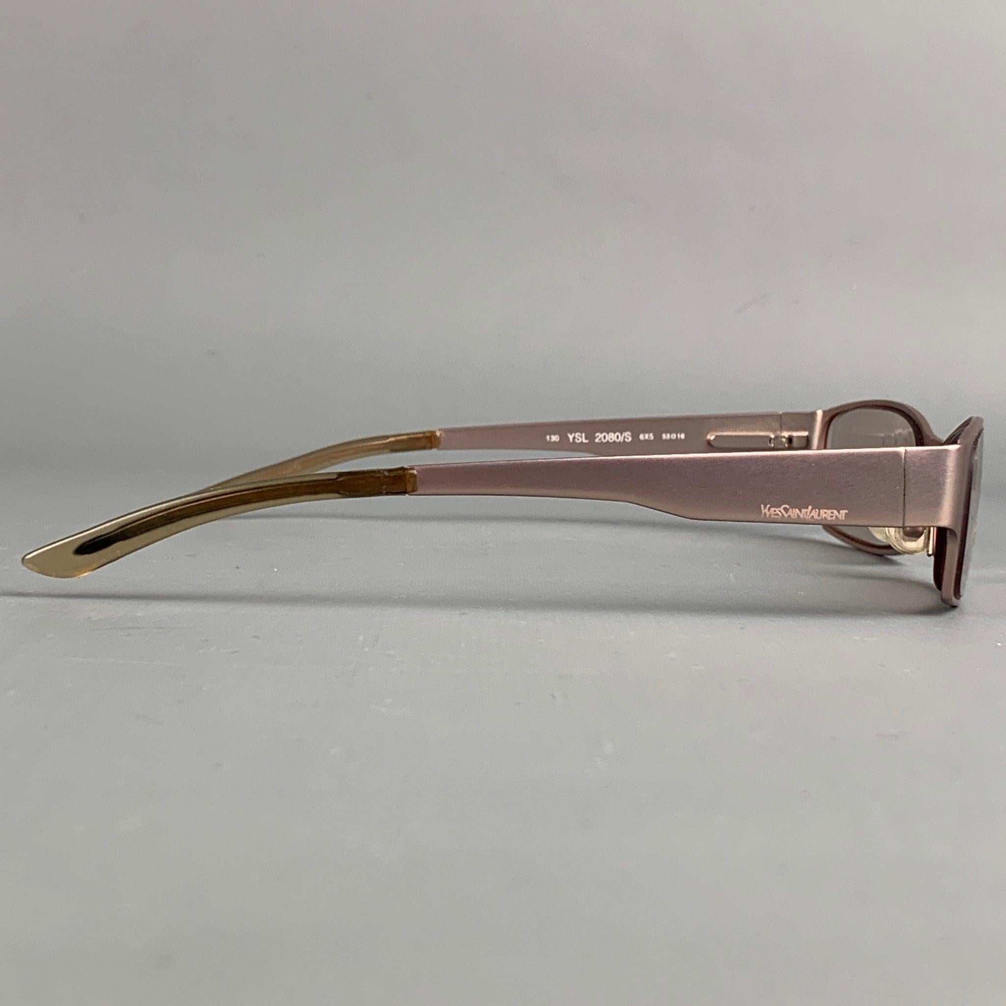 YVES SAINT LAURENT frames comes in a pink metal featuring tinted lenses. Includes case. Made in Italy.
 Good
 Pre-Owned Condition. 
 

 Marked:  YSL 2080/S  
 

 Measurements: 
  Length: 14 cm. Height: 3 cm.
  
  
  
 Sui Generis Reference: 112129
