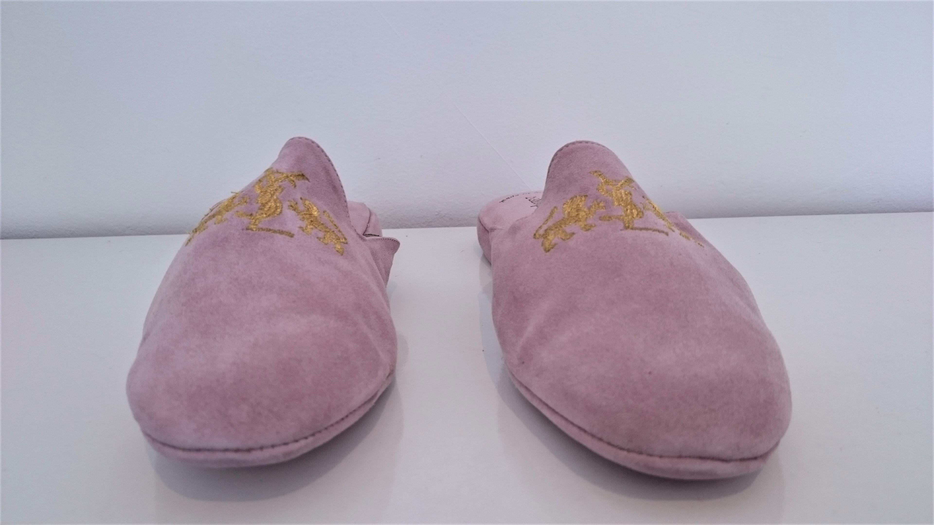Yves Saint Laurent Pink Suede Slippers for Home. 
YVS Logo engraved on the top of each shoe.
NEW, never worn.
Original Yves Saint Laurent Pink Suede Bag included.
Size 10 1/2 
Made in Italy