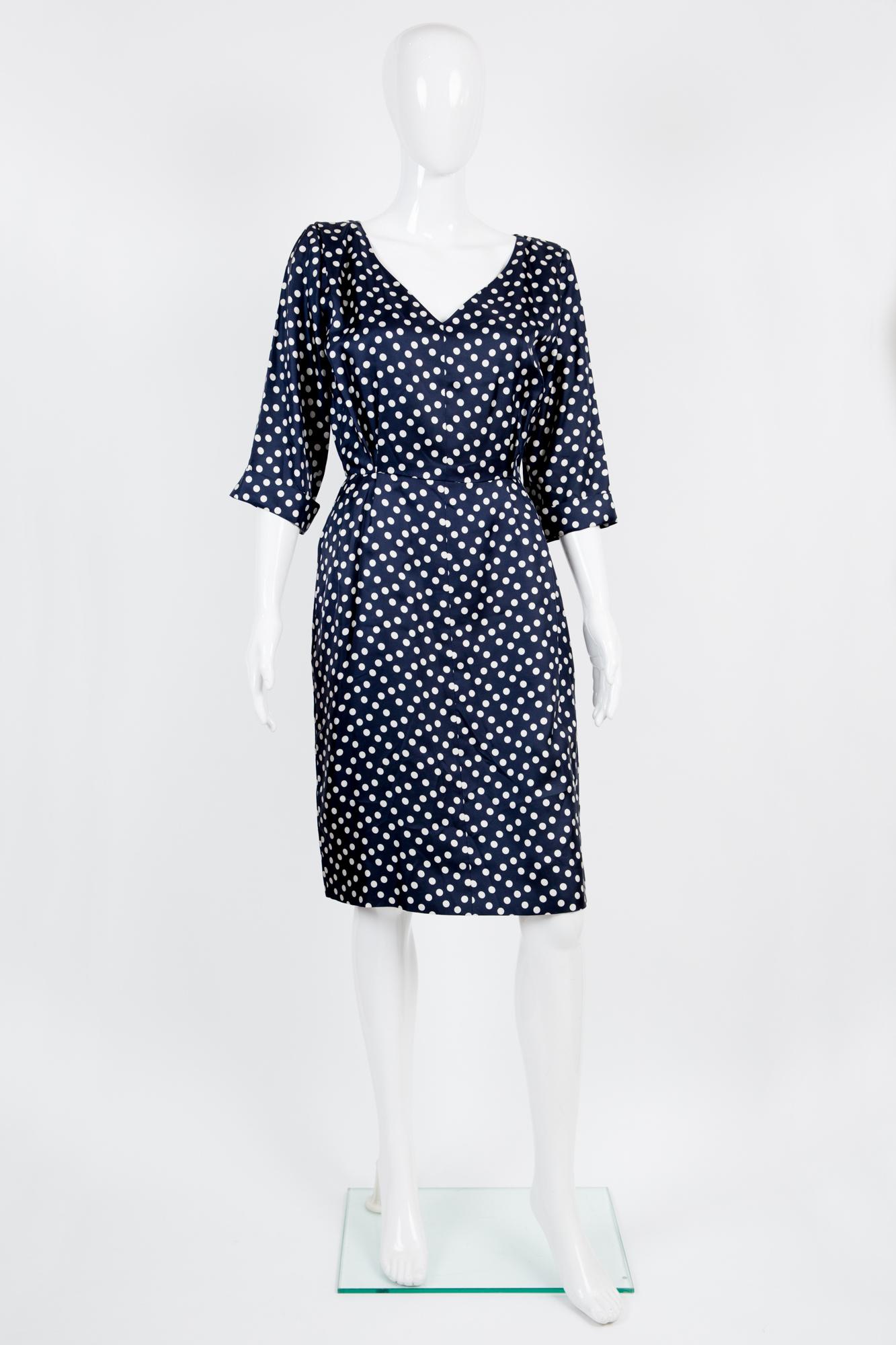 Yves Saint Laurent silk dress featuring a polka dot print, 3/4 sleeves with a turn cuff, a side zip opening. 
100% silk
In excellent vintage condition. Made in France. 
Estimated size 36fr/ US4/ UK8
We guarantee you will receive this gorgeous item