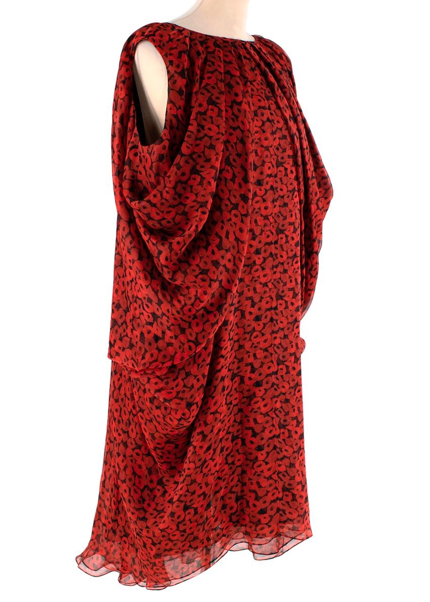  Yves Saint Laurent Poppy Print Silk Midi Dress 
 

 -Stunning Yves Saint Laurent silk dress
 -Lightweight with an all-over red and black poppy print
 - Sleeveless, draped round neck and a floaty silhouette
 - Lined
 

 Materials 
 100% Silk 
 

