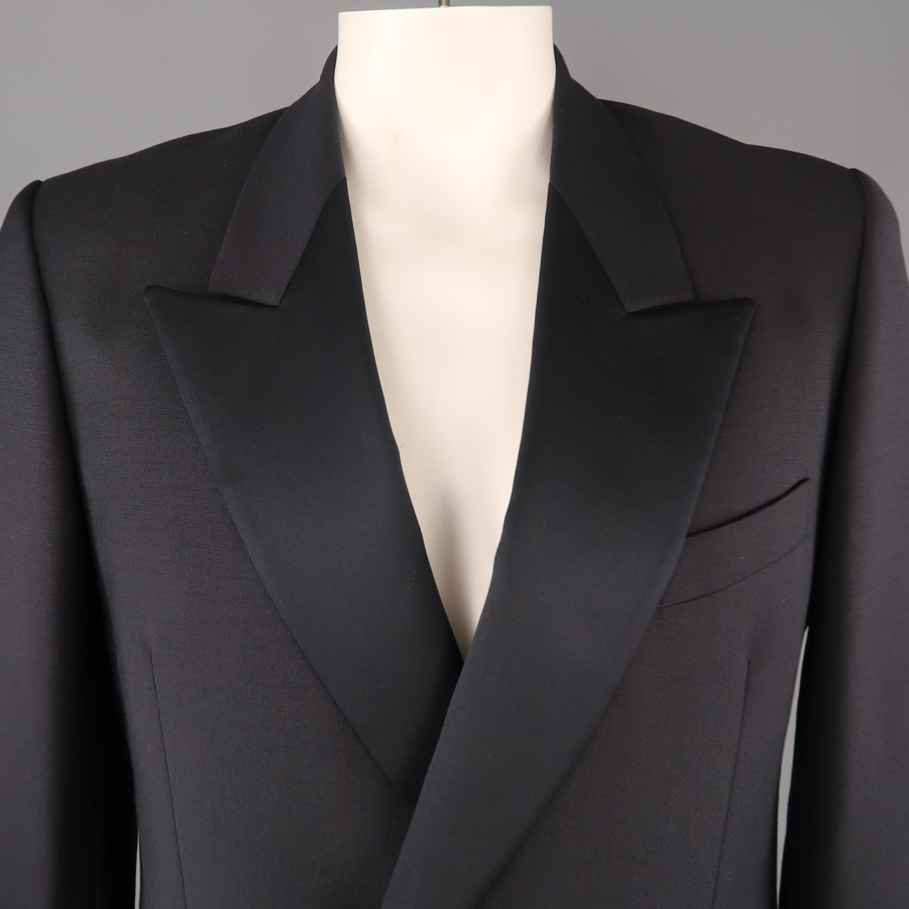 Vintage YVES SAINT LAURENT POUR HOMME sport coat comes in navy wool with a double breasted button front and half satin peak lapel. Made in France.
 
Excellent Pre-Owned Condition.
Marked: (no size)
 
Measurements:
 
Shoulder: 18 in.
Chest: 44