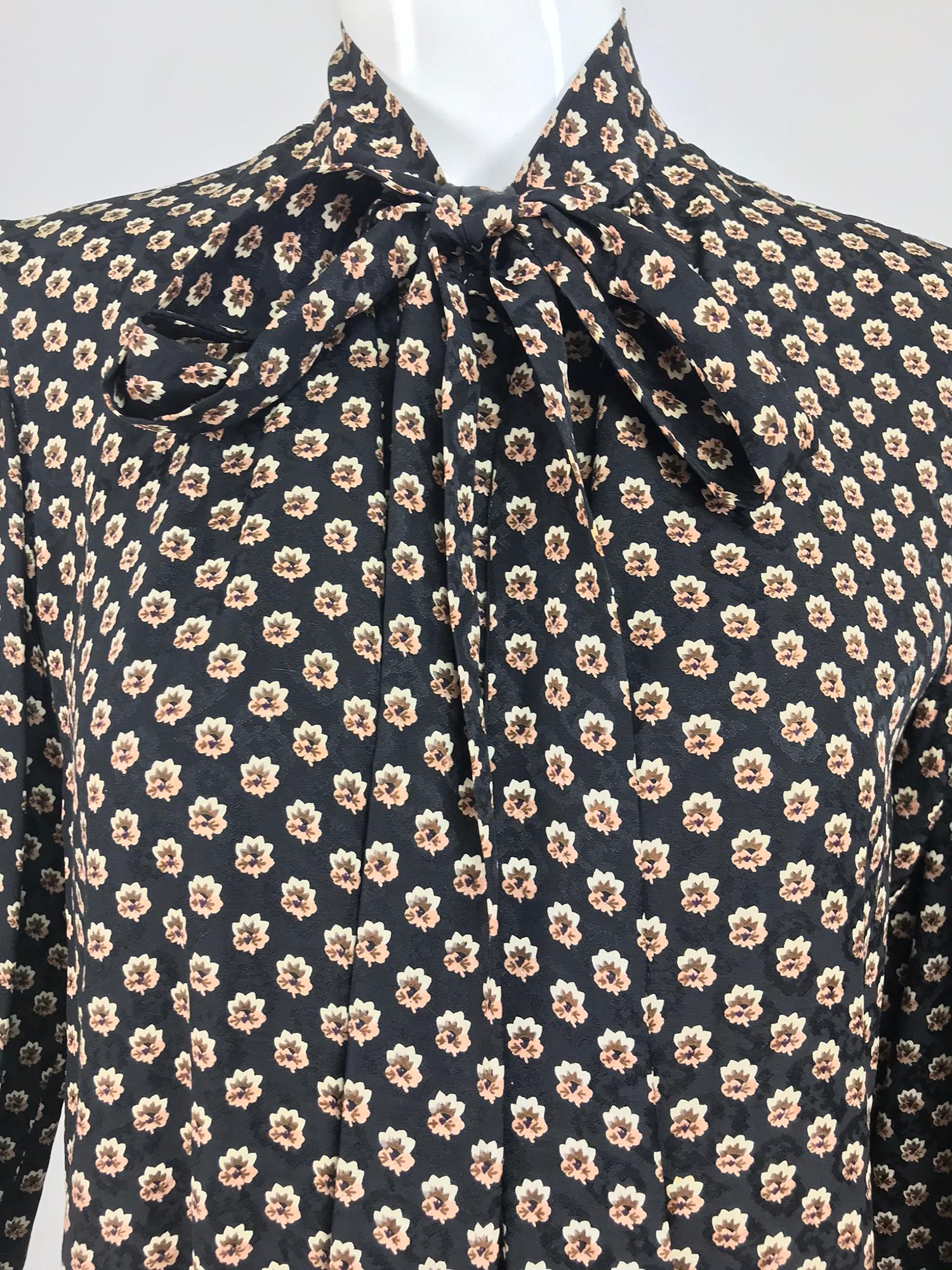 Yves Saint Laurent Provincial Print Silk Bow Neck Blouse from the 1970s.  Yves Saint Laurent designed the best blouses, always simple in design and elegant when worn, they never go out of style. From the 1970s this Provincial print blouse has a