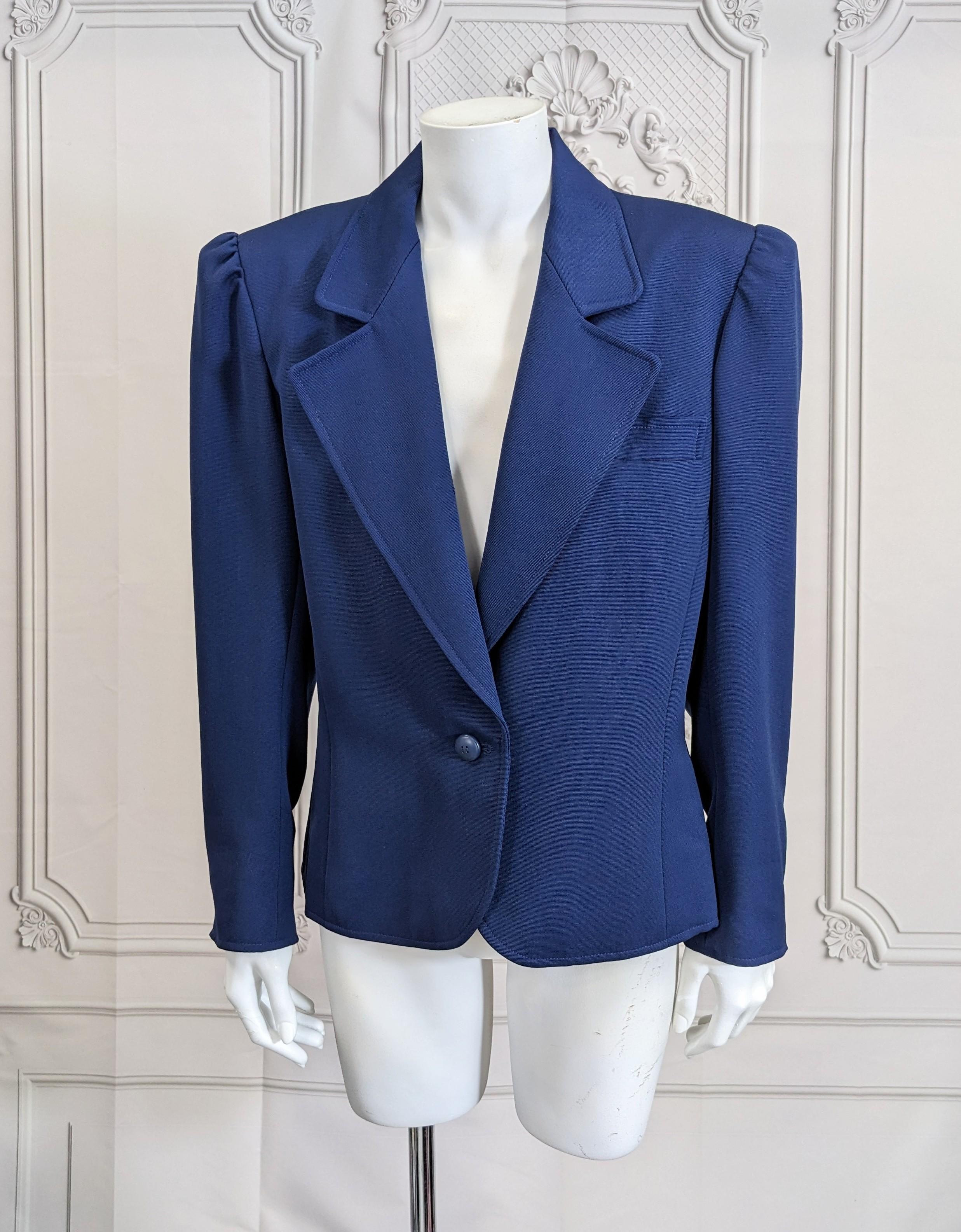 Yves Saint Laurent Puff Sleeve Blazer in deep blue faille. YSL cuts the best blazers around. Strong shoulders with the body of the jacket grazing over the body as opposed to tight. Single button closure. 
A forever wardrobe staple. Size 42 France.