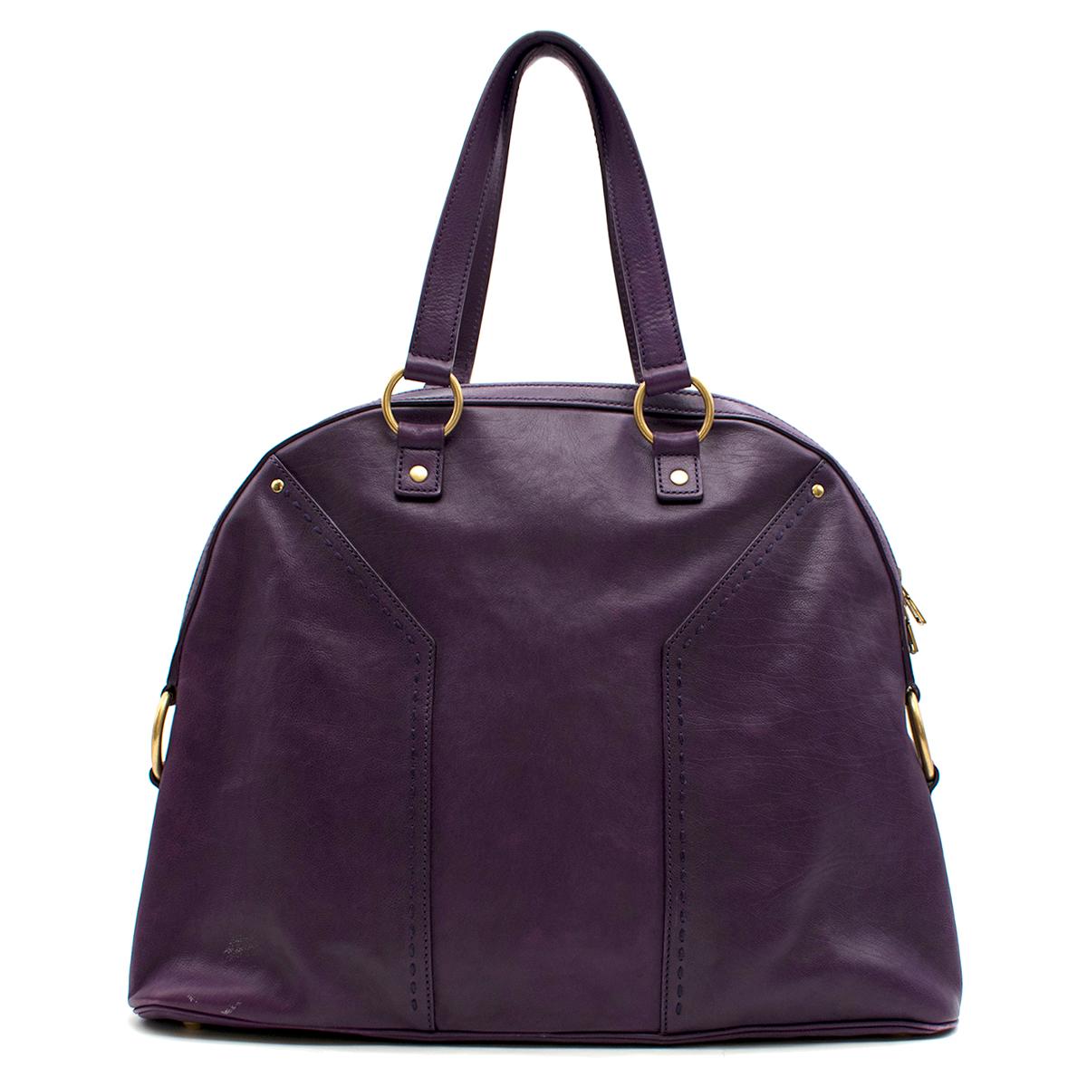 Yves Saint Laurent Purple Leather Oversized Muse Bag 

- Purple Muse Shoulder Bag
- Oversized, spacious design 
- Purple Knit
- Gold toned hardware 
- Metal feet 
- Padlock and keys attached 
- Dual leather top handles 
- Zip fastening closure 
-