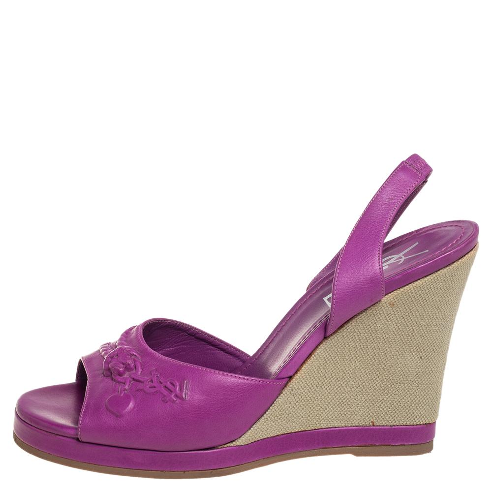 Simply luxe, these sandals from Yves Saint Laurent will help you stay comfortable throughout the day! The purple sandals are crafted from leather and designed with open toes and slingbacks. They are equipped with comfortable insoles and elevated on