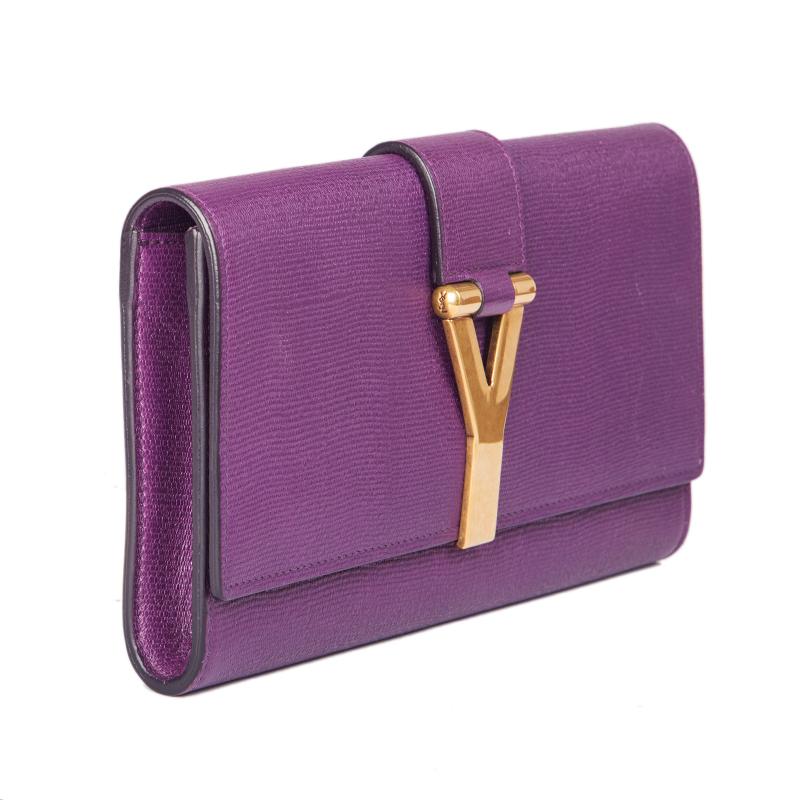 Yves Saint Laurent 'Y' clutch in purple textured leather. Closes with a magnetic-snap under the flap. Lined in pink satin with an open pocket against the back. Has been carried and is in excellent condition.

Height 13cm (5.1in)
Width 24.5cm
