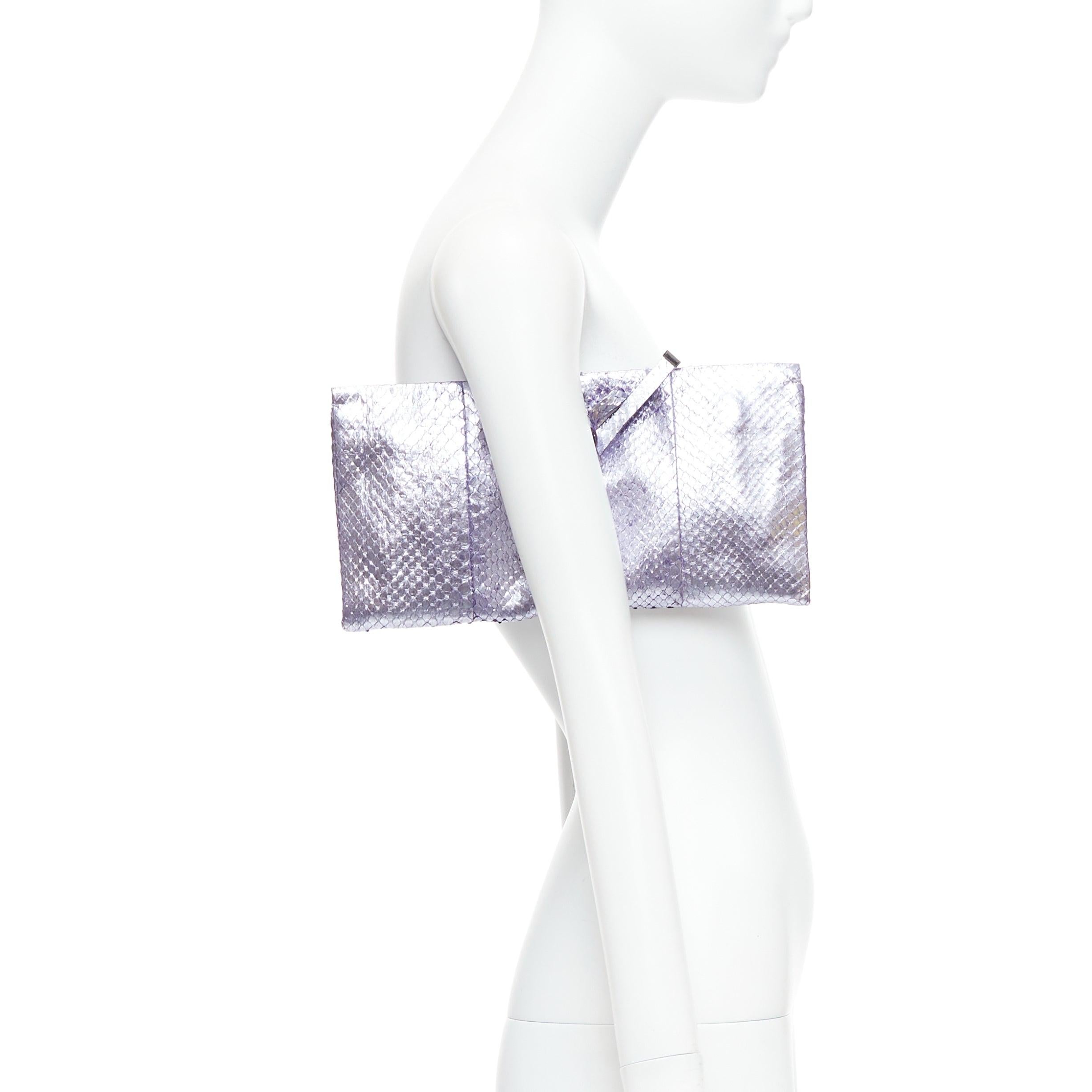YVES SAINT LAURENT purple metallic scaled leather wraparound clutch bag
Reference: PYCN/A00116
Brand: Yves Saint Laurent
Material: Leather
Color: Purple, Silver
Pattern: Animal Print
Closure: Wrap Tie
Lining: Black Leather
Extra Details: Small logo