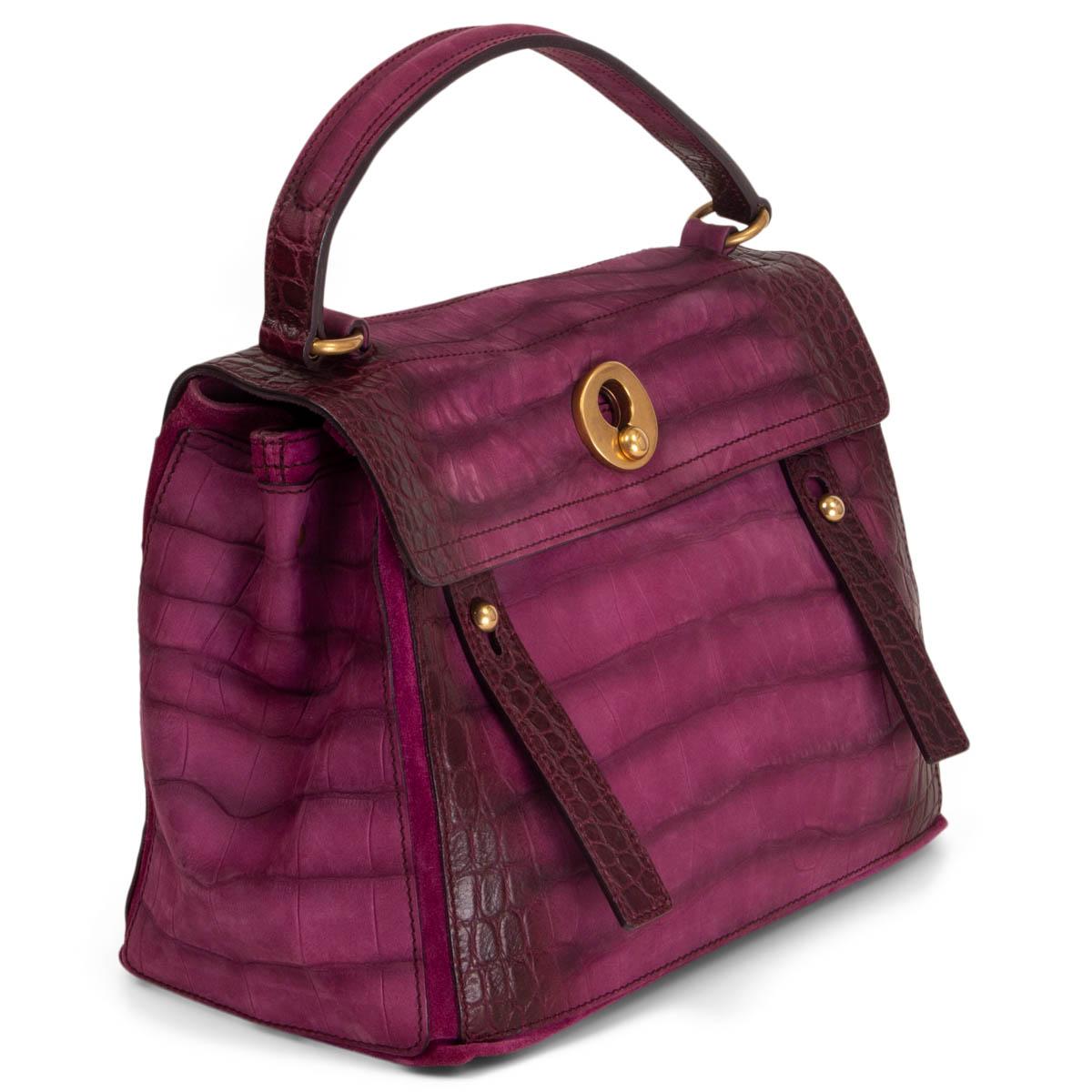 100% authentic Yves Saint Laurent Muse Two Medium handbag in magenta and burgundy croc embossed nubuck and details in suede. Opens with two straps and is lined in magenta suede with one big zipper pocket in the middle. Has an extra pocket on the