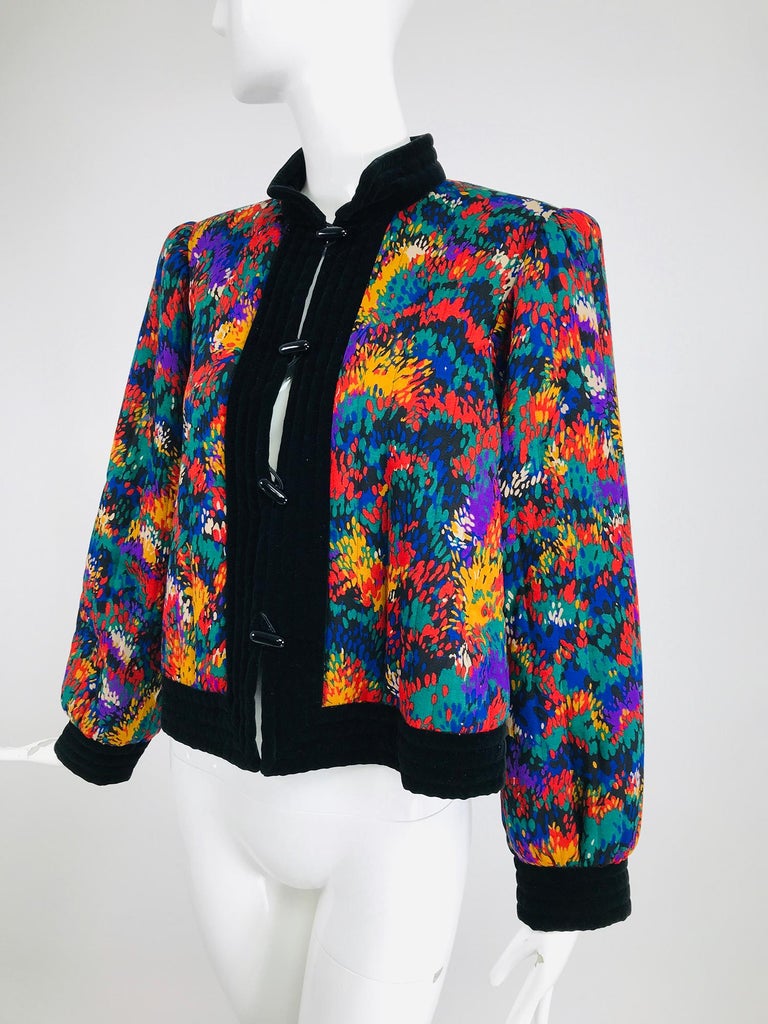 Yves Saint Laurent quilted modernist print challis and velvet jacket from the 1980s. This beautiful jacket is perfect for fall, the wool challis is done in a bright modernist print. The front facings, collar, cuffs and hem are quilted black velvet.