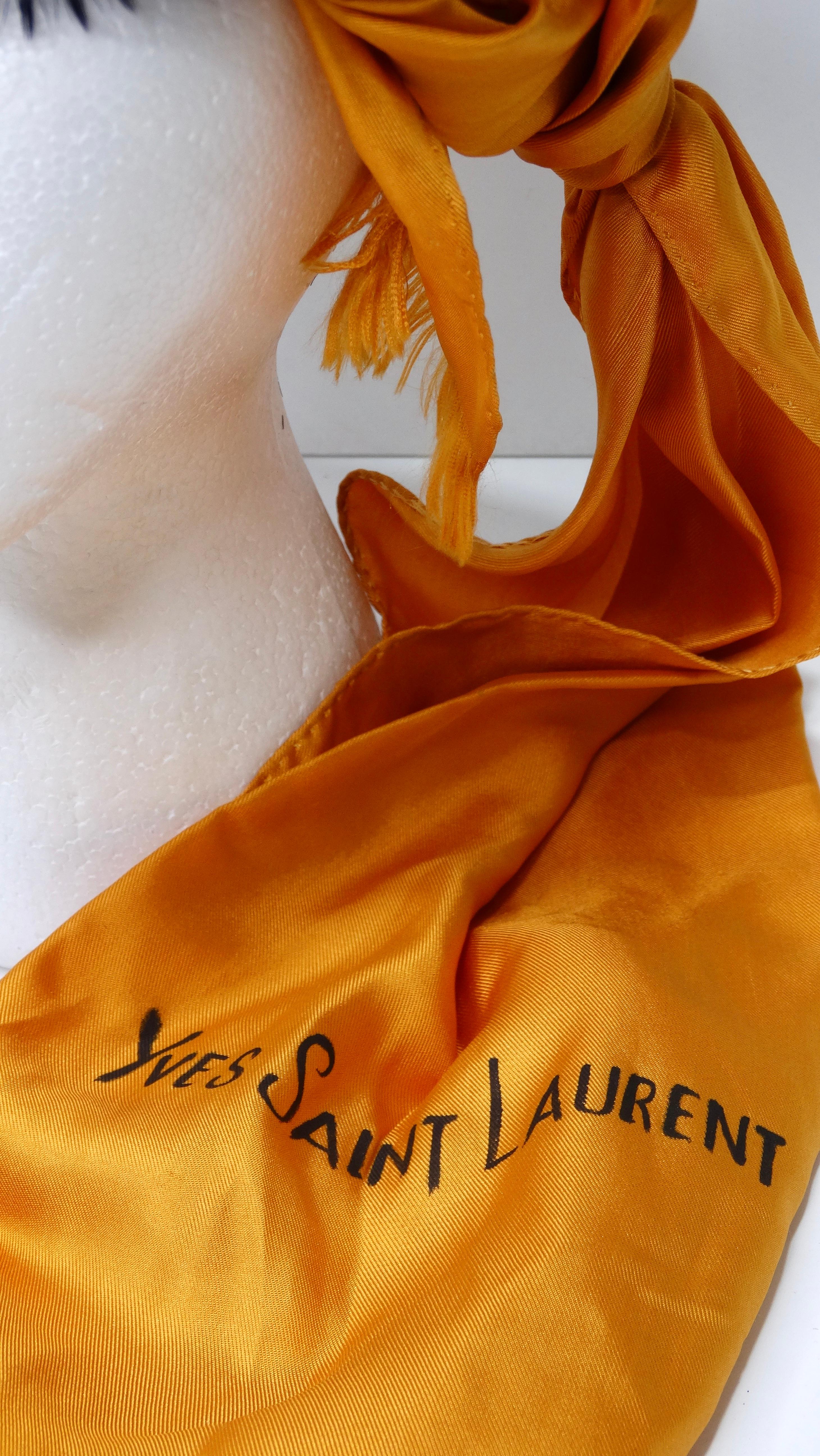 Amp up your accessory collection with this cool Yves Saint Laurent hat with a beautiful orange silk scarf with a unique tied-on look! This wonderfully elegant and rare Yves saint Laurent orange jacquard silk hand-stiched orange scarf is accented