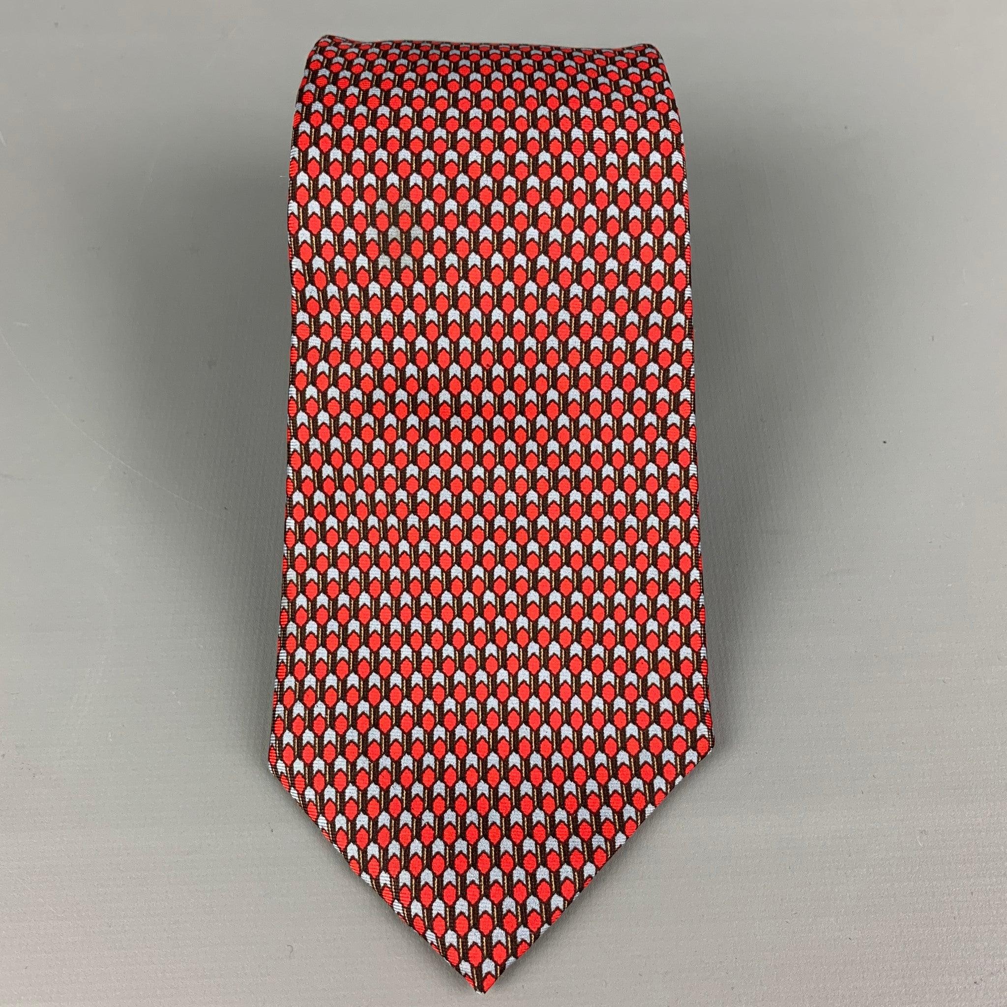 YVES SAINT LAURENT
 necktie comes in a red & blue silk twill with a all over abstract print. Very Good Pre-Owned Condition.Width: 3.5 inches 
  
  
  
 Sui Generis Reference: 118705
 Category: Tie
 More Details
  
 Brand: YVES SAINT LAURENT
 Color: