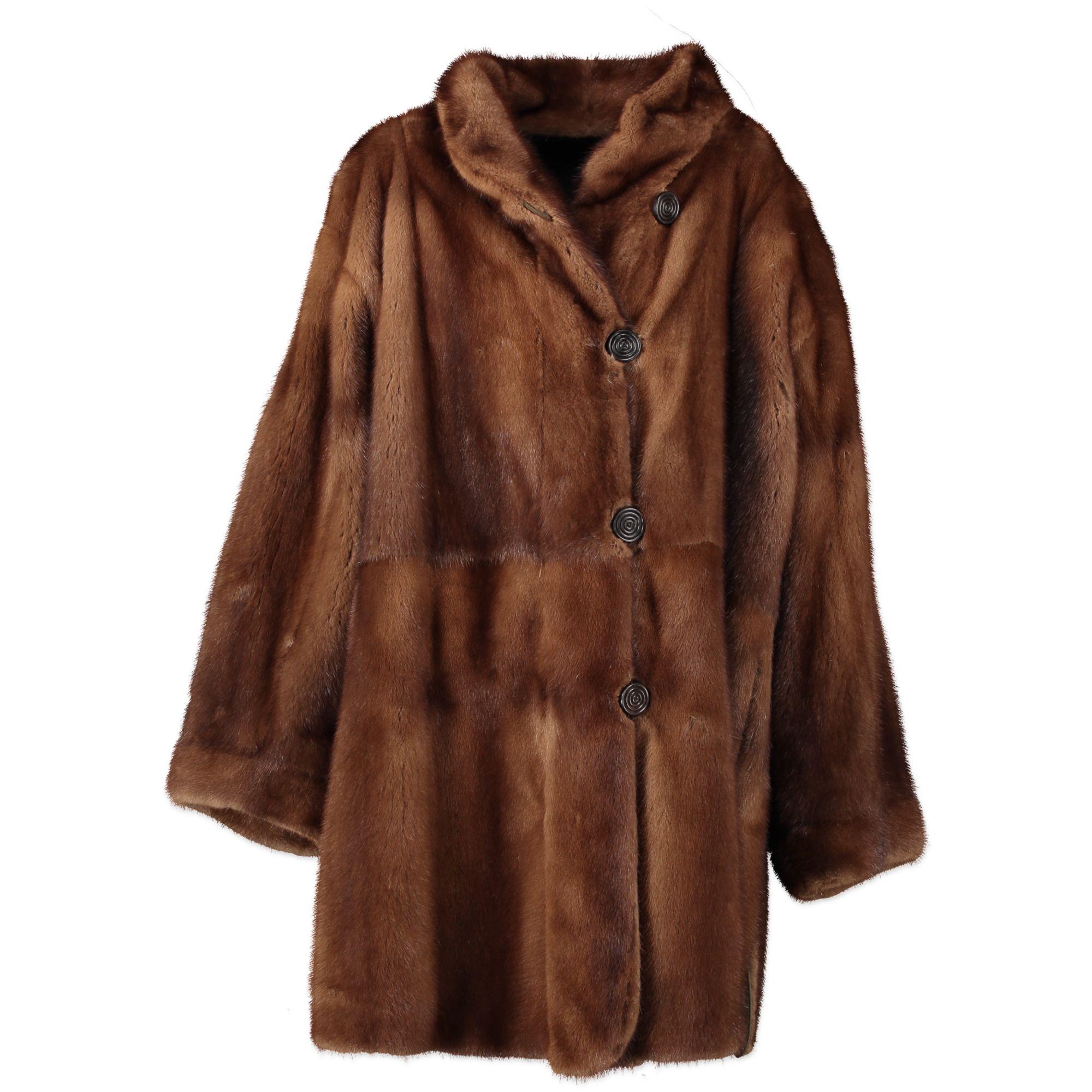 Get two coats for the price of one with this gorgeous YSL coat. This piece is versatile as ever as it can be worn on two different sides. It has a brown fur side to go for a classic style and a dark green shearling side for a more casual vibe. It