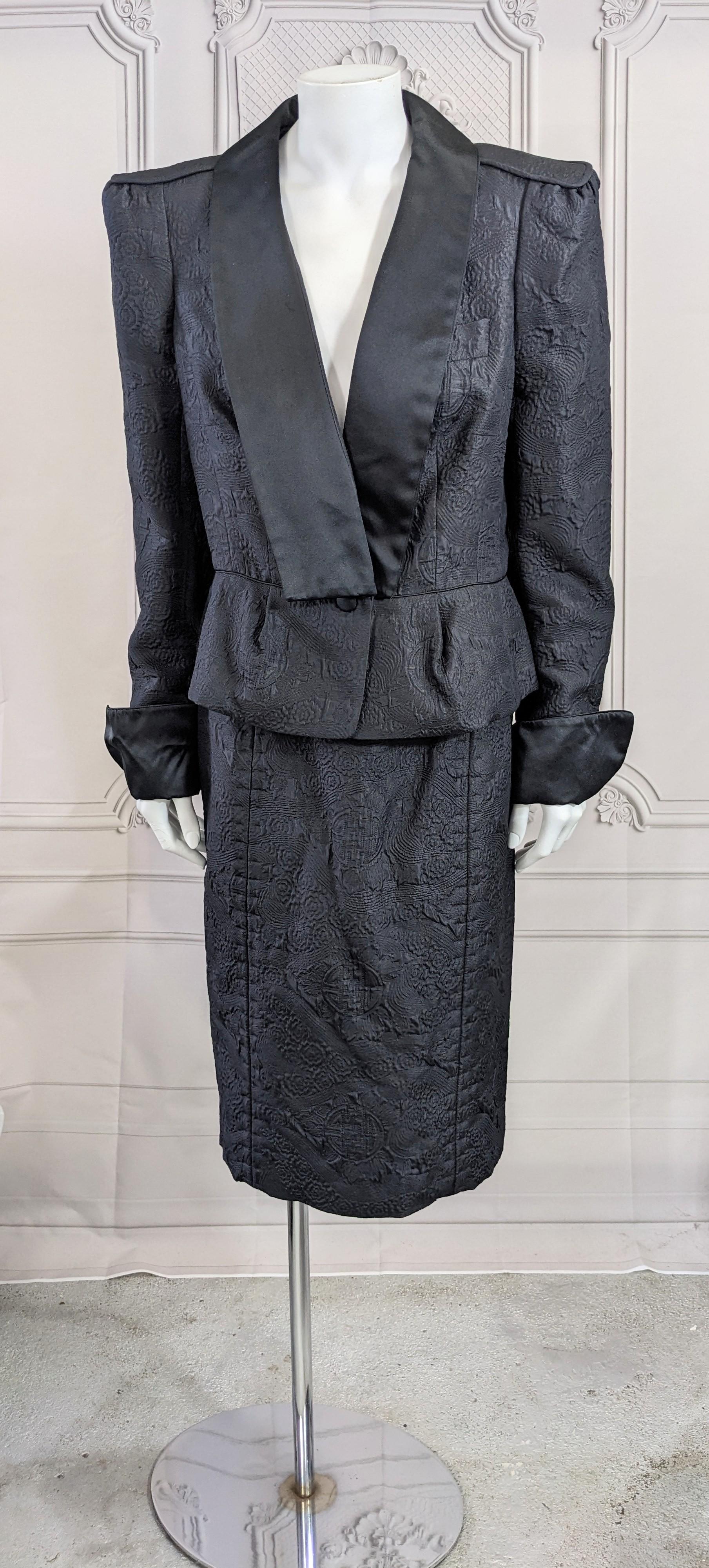 Yves Saint Laurent Rive Gauche by Tom Ford Chinese Collection Suit F/W 2004. Matelasse quilted wool/silk custom textile with Chinese symbols are paired with black silk satin in a homage to traditional Chinese combinations. 
Jacket has extended
