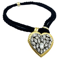 Yves Saint Laurent rhinestone Heart hanging from a double black cord, 1980s