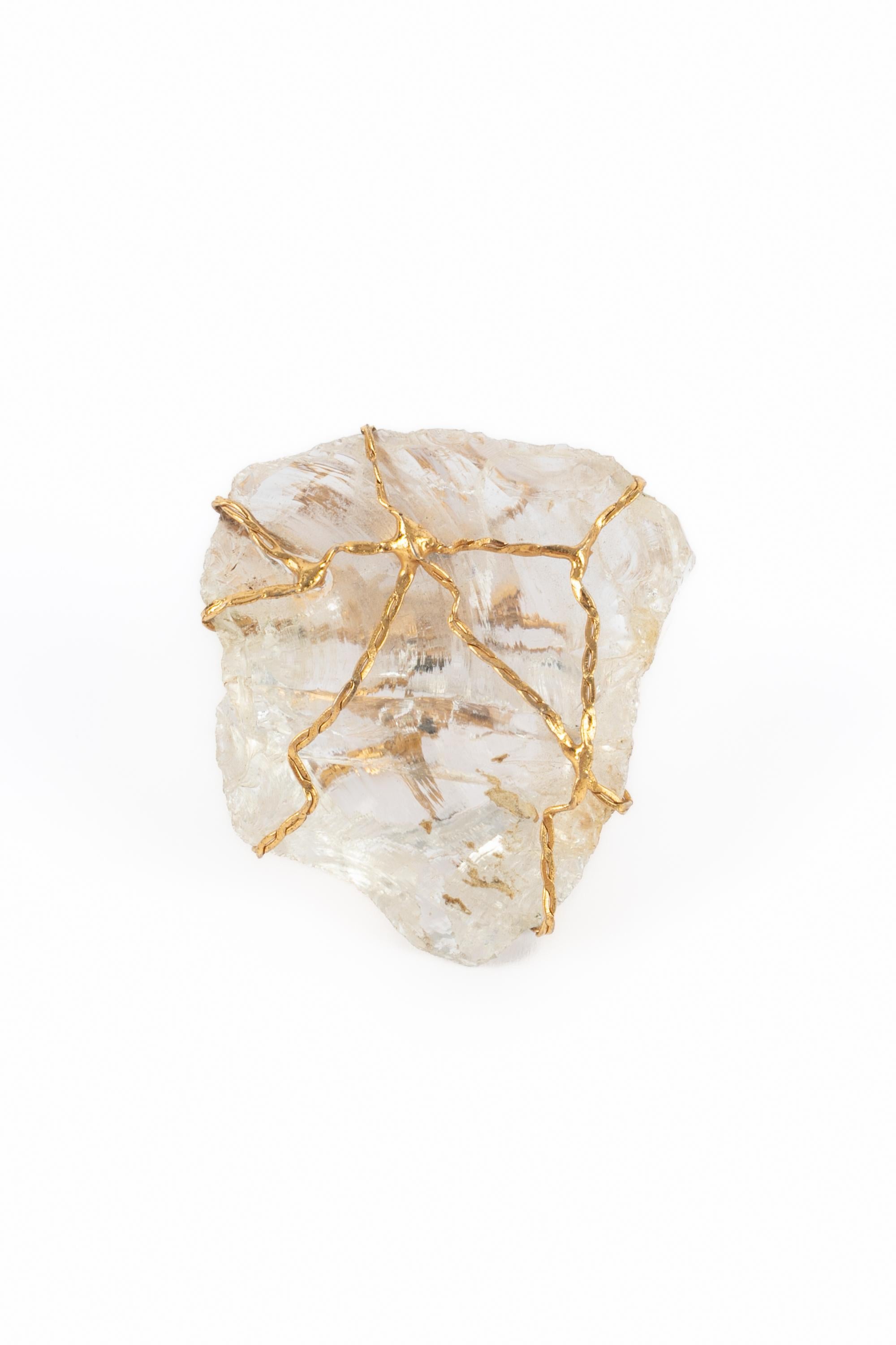 YVES SAINT LAURENT - (Made in France) Fabulous golden metal ring with rock crystal hold by brass net. Signed by Yves Saint Laurent. Made by the Robert Goossens Atelier. On the picture, Katoucha Niane is wearing Yves Saint Laurent jewelry - 1988