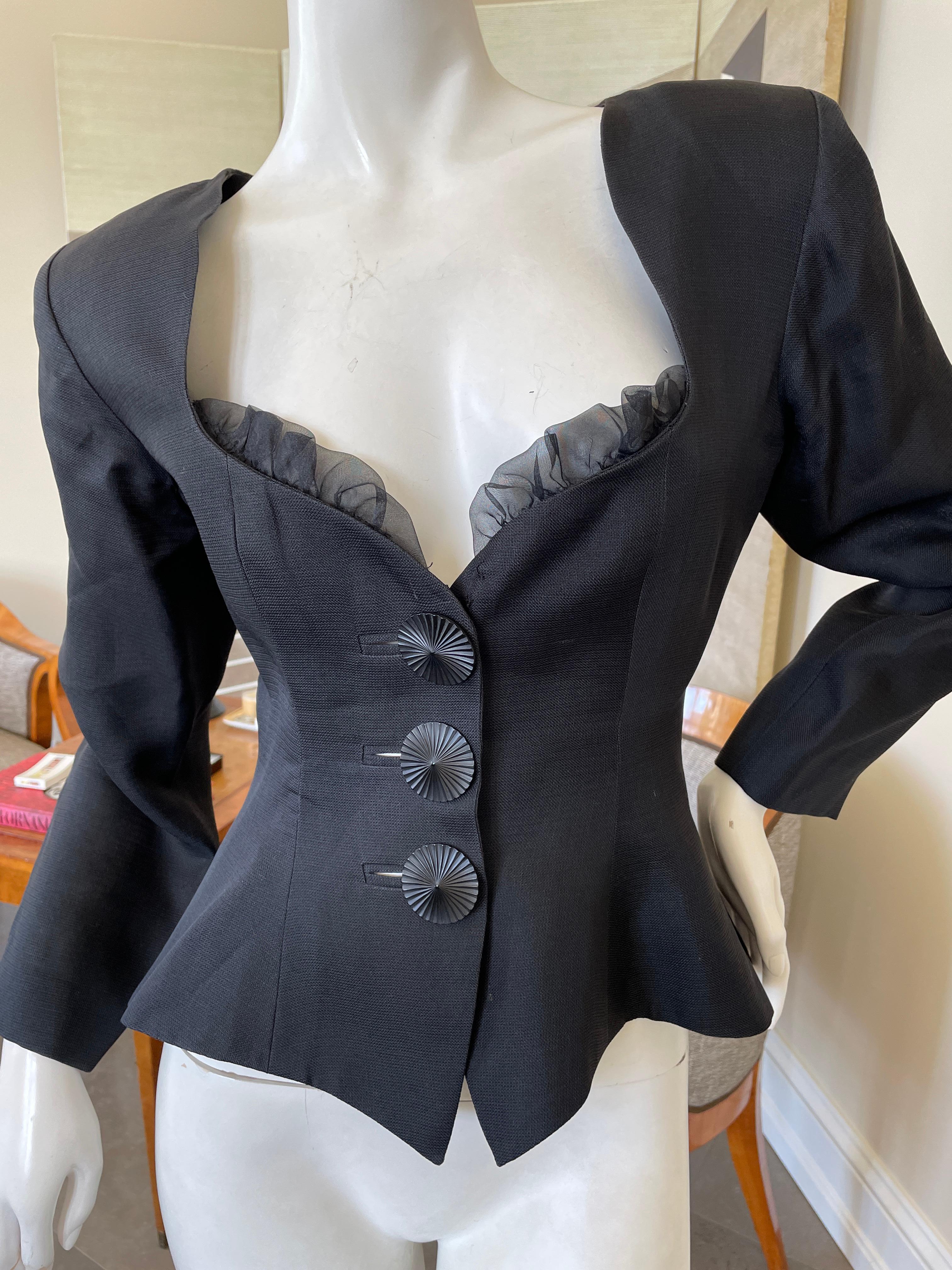 Yves Saint Laurent Rive Gauche 1970's Low Cut Black Silk Top.
This is classic YSL, with large decorative buttons.
 Size 36
 Bust 36