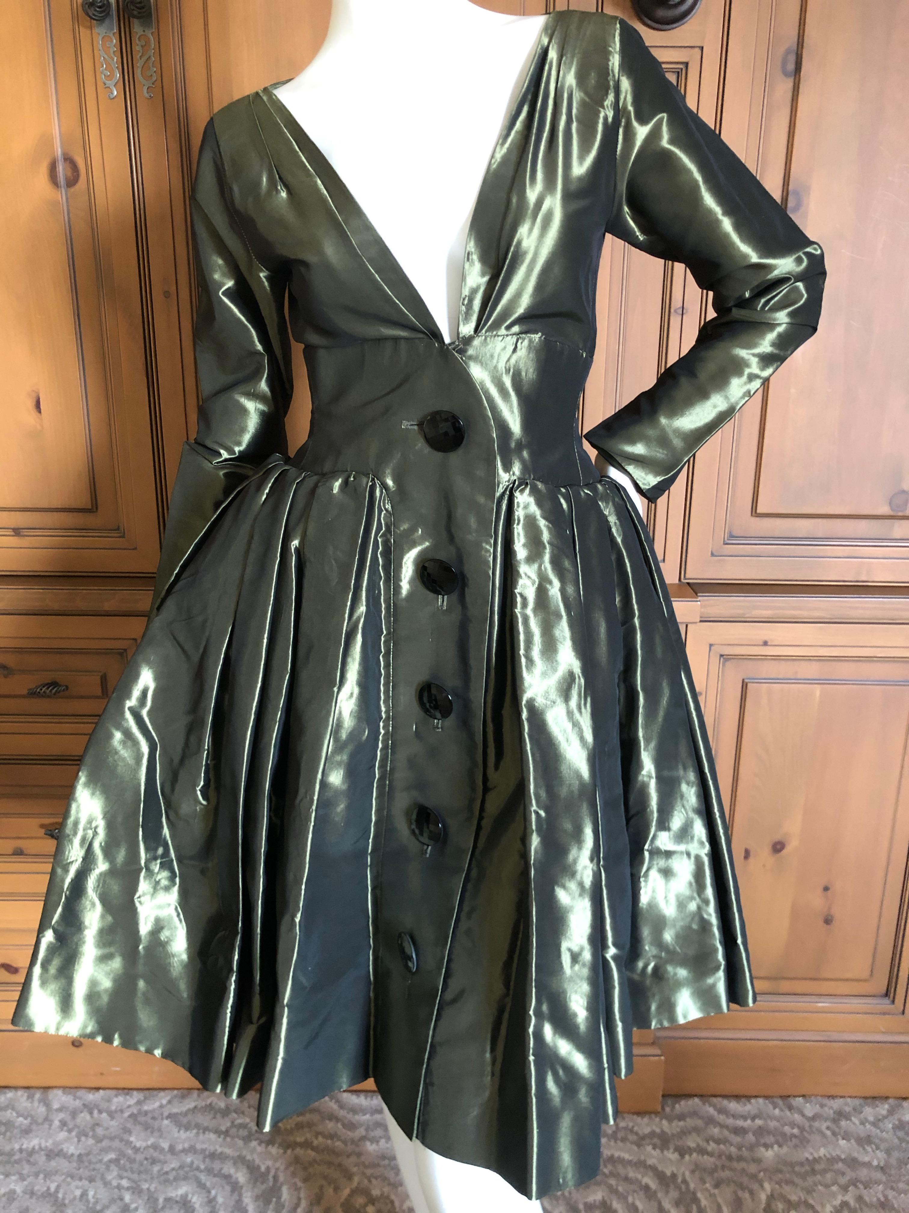Yves Saint Laurent Rive Gauche 1970's Low Cut Metallic Taffeta Pleated Dress.
This is aso pretty, the photo's don't quite capture it's details.
Please use the zoom feature to see details.
There are two hook and eye closures at the bust that I didn't