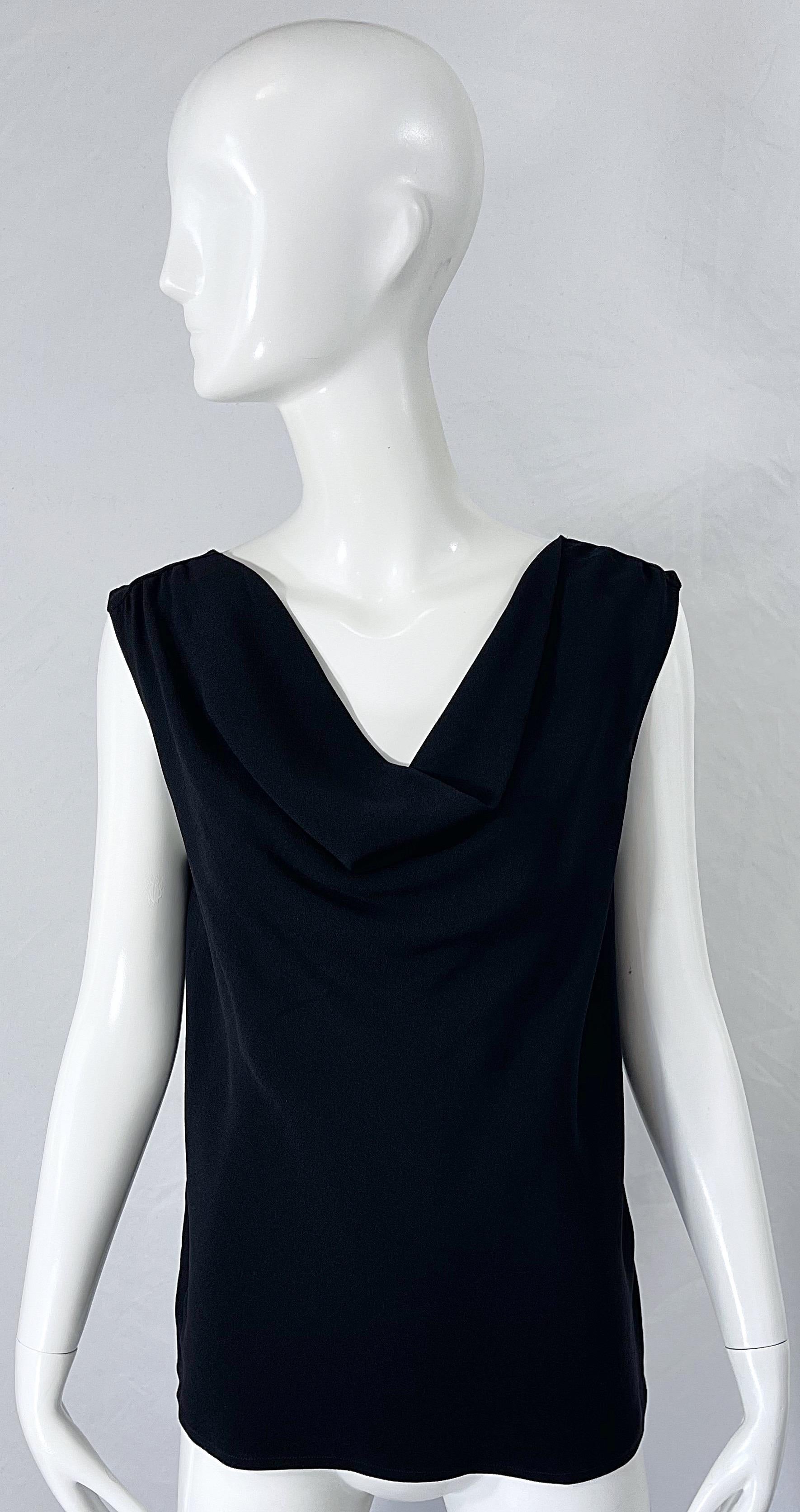 Chic early 90s YVES SAINT LAURENT YSL Rive Gauche black rayon draped sleeveless top ! The perfect black shirt to dress up or down. Great with jeans, shorts, or a skirt. Simply slips on.
In great condition 
Made in France
Approximately Size