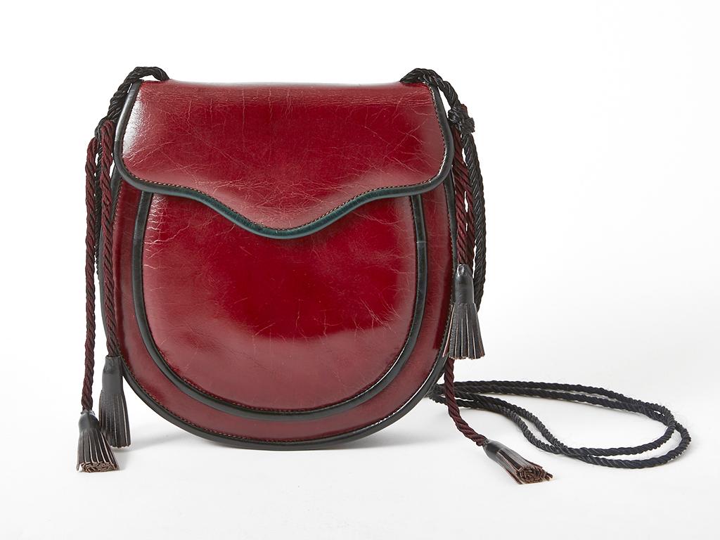 Yves Saint Laurent, Rive Gauche, oxblood tone, Moroccan inspired,  leather, shoulder bag. C. 1970's. 