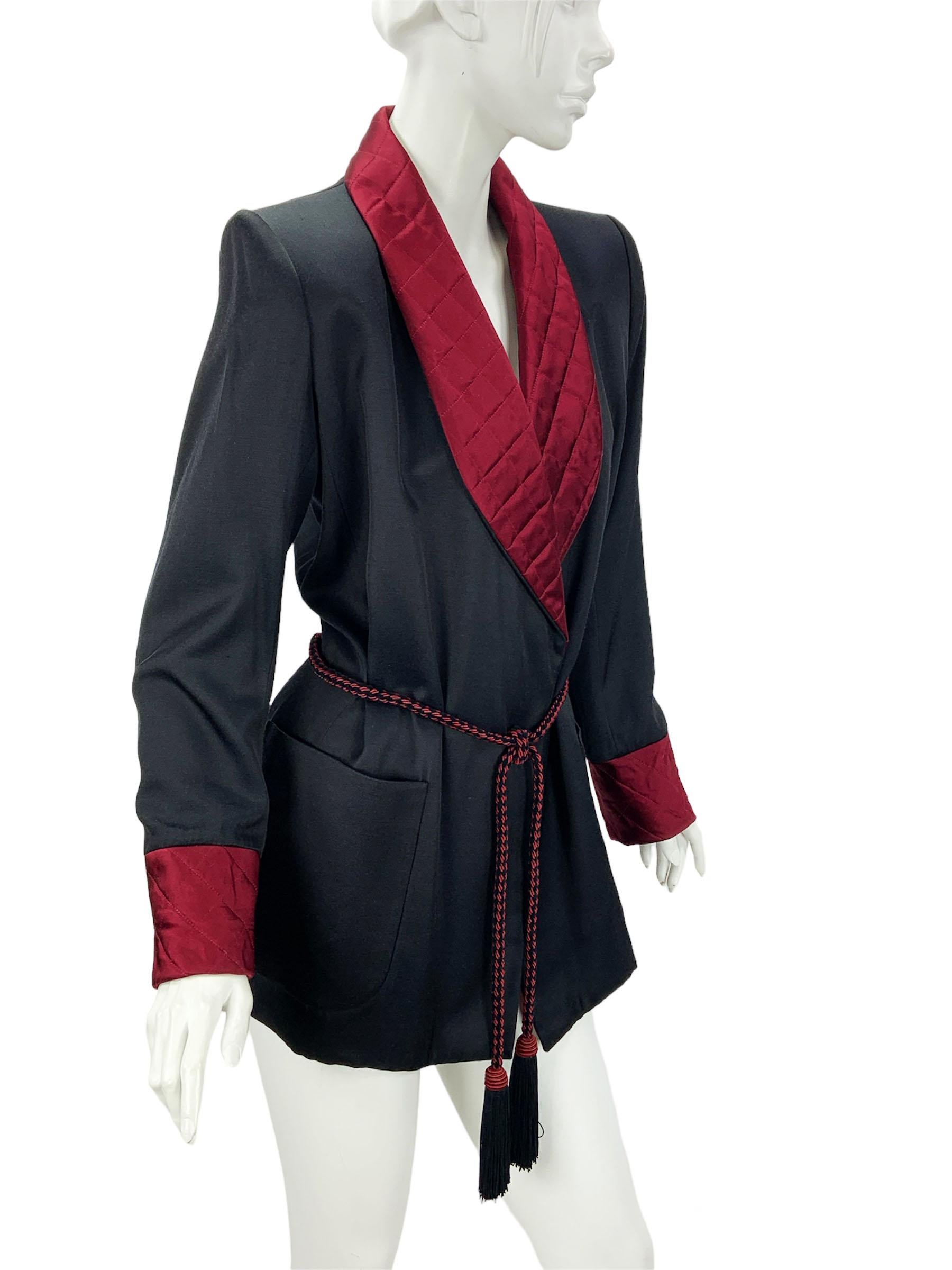 Vintage 80's Yves Saint Laurent Rive Gauche Le Smoking Jacket
French size - 38 
Black with burgundy quilted shawl lapel and cuffs, Two deep pockets, Twisted rope belt with tassels.
43% silk, 40% wool, 17% rayon. Fully lined. Belt closure. Padded