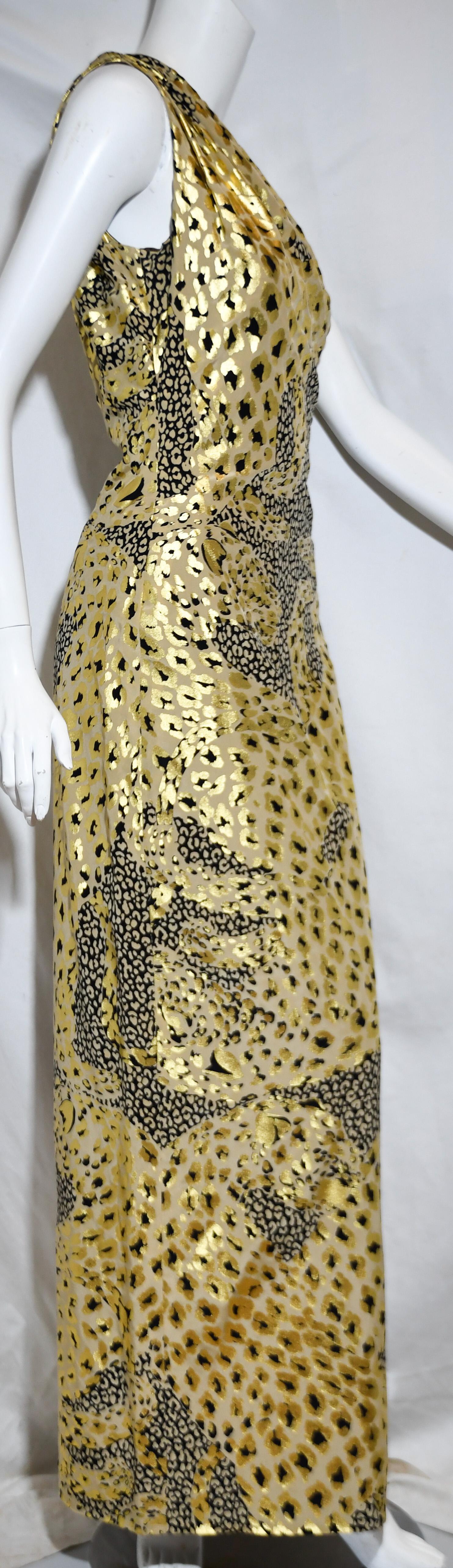 Yves Saint Laurent Rive Gauche metallic gold and black leopard print long evening gown is gathered at one shoulder and drapes across the front of the bust and, also, at the back.  Gown includes a side zipper for closure and a side slit.  The leopard