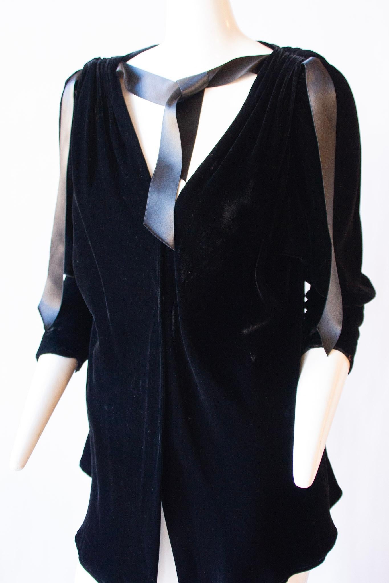 Yves Saint Laurent rive gauche, black velvet capelet with ribbon ties and snap front closure

30