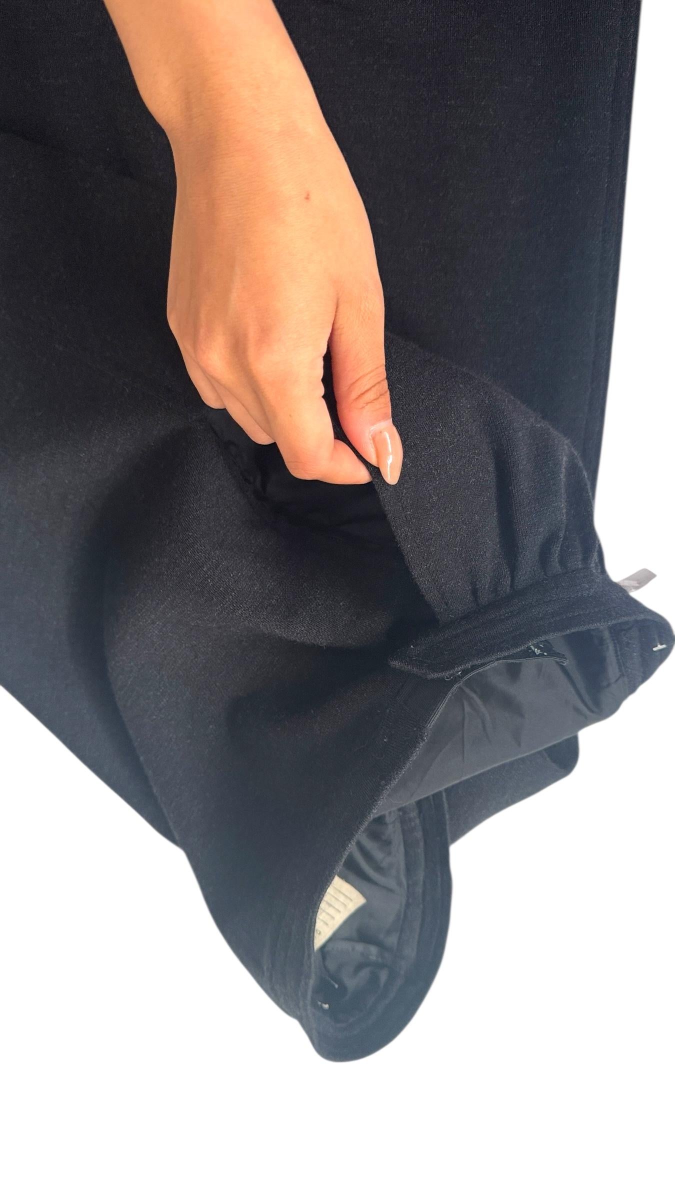 Timeless and refined, this vintage Yves Saint Laurent Rive Gauche skirt perfectly captures the maison’s balance of structured tailoring and effortless femininity. Crafted in France from a soft black wool blend, it features a classic A-line