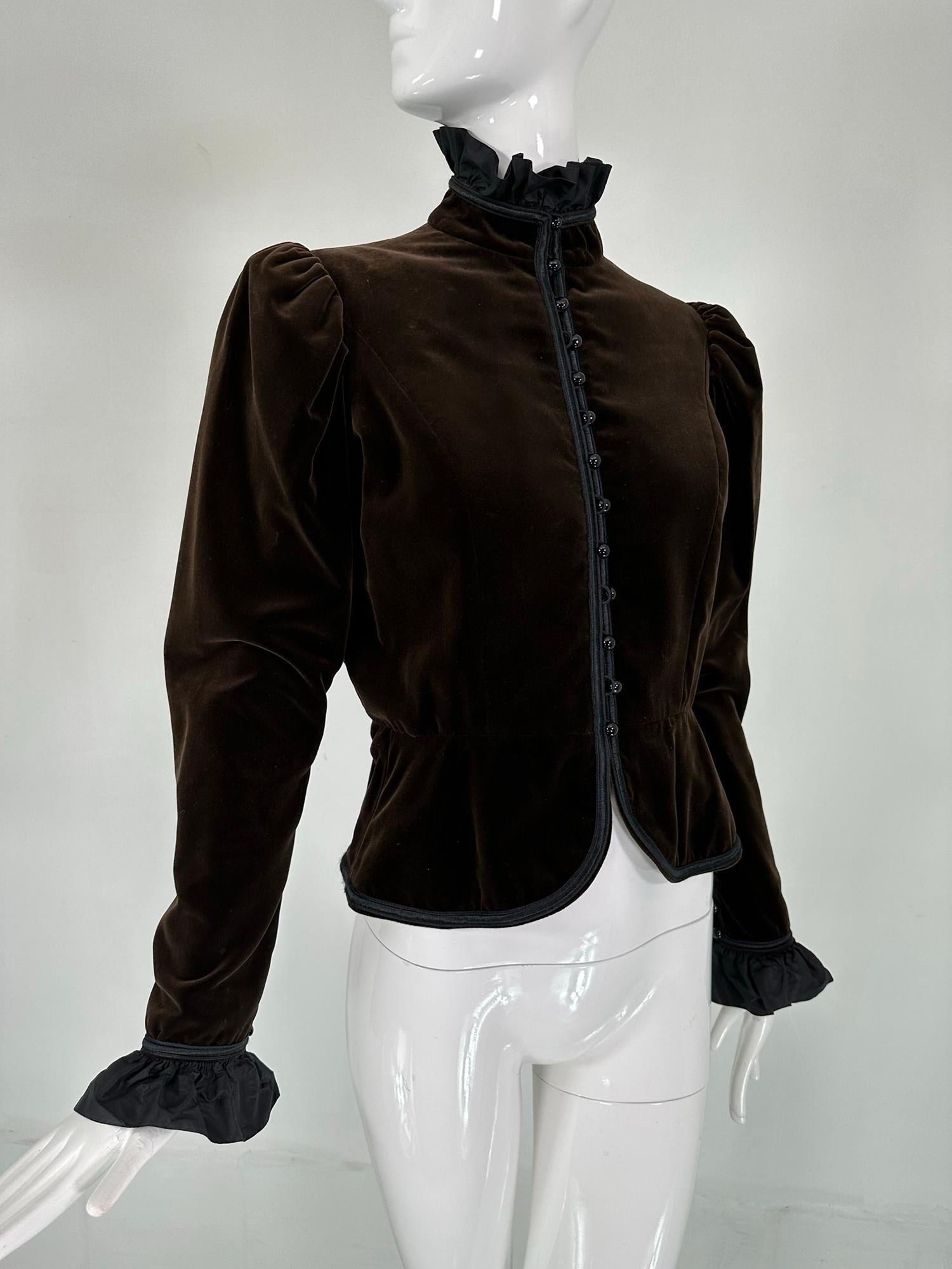 Yves Saint Laurent Rive Gauche chocolate brown velvet, Victorian style jacket from 1971-72. Beautiful velveteen jacket with a high neck black silk taffeta neck & cuffs. Long sleeves have have full puff shoulders that taper to the button wrists &