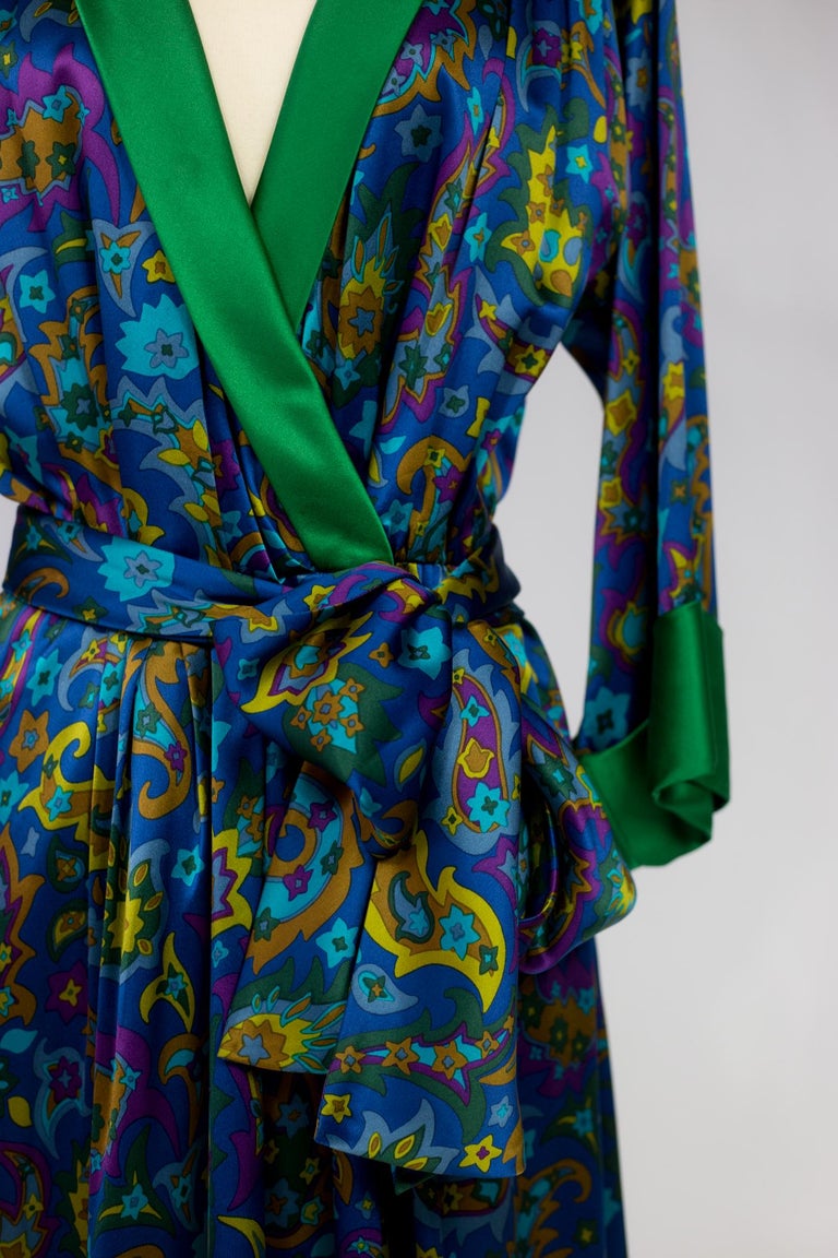 Autumn Winter 1985 Collection

France

Beautiful silk satin printed cocktail dress by Yves Saint Laurent Rive Gauche inspired by the 1930s/1940s pyjamas and reception dressing gowns. Paisley printed silk satin bottom with a vivid polychromy on a