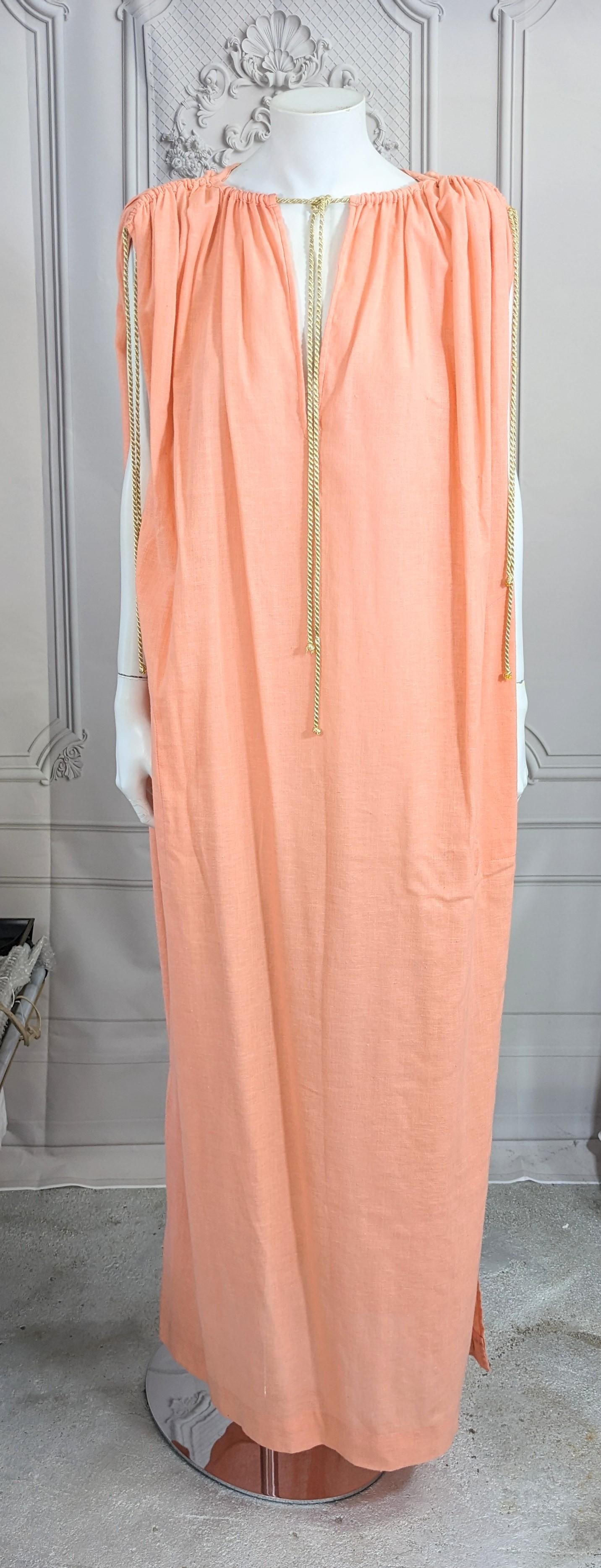 Rare Yves Saint Laurent Rive Gauche Early Peach Gauze Toga from the 1970's. Pale peach cotton gauze is simply gathered with gold lame cords at shoulder and neckline. YSL in this time period was creating the important timeless codes of the YSL house