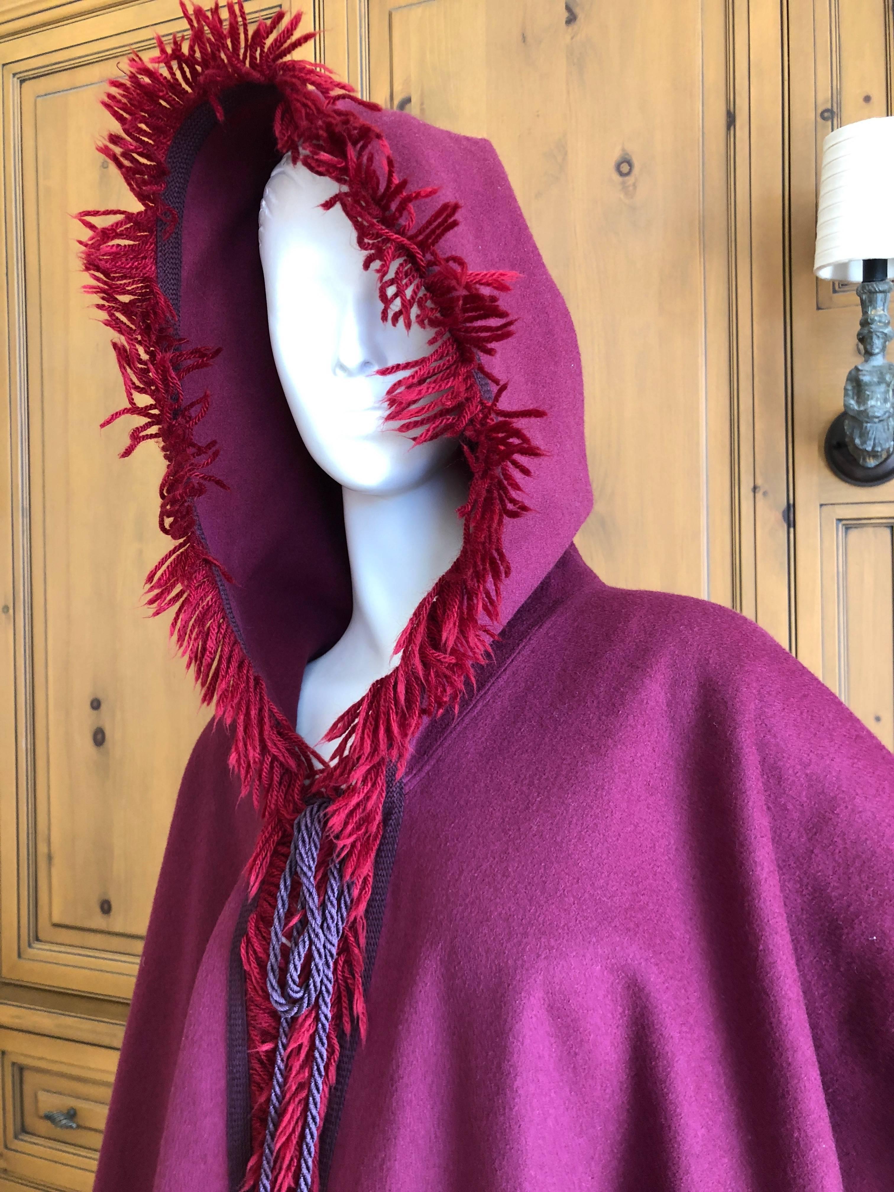 Yves Saint Laurent Rive Gauche Purple Cape with Hood and Tassels.
Of all the Capes YSL designed, this one is the best. WIth sutache and double tassels on the front, hooded with a long tassel down the back.
Rare to find in this color.
In excellent