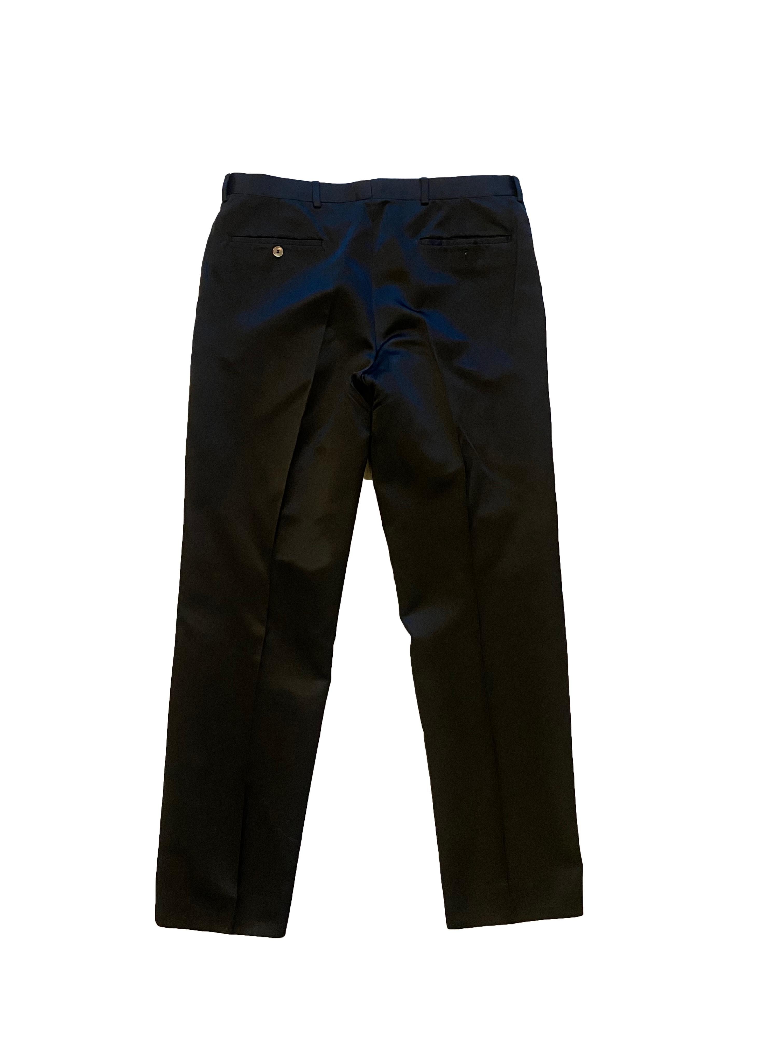 Gents black silk suit from Yves Saint Laurent Rive Gauche. Tailored trousers and matching jacket. With collar and lapels, and fastened with a single black button. Flap over pockets either side of hip and diagonally cut breast pocket, with 4