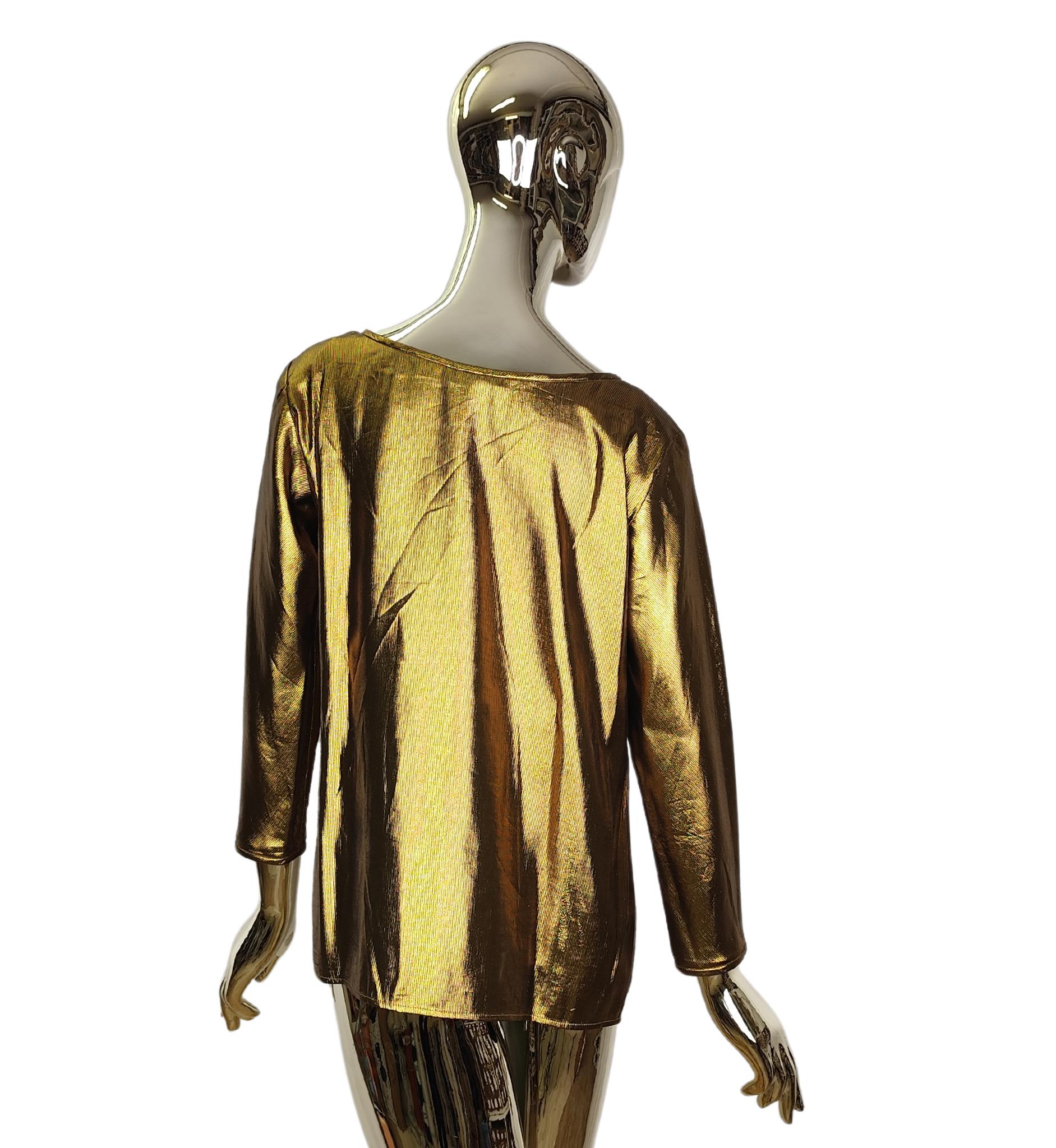 Yves Saint Laurent Rive Gauche top
Gold polyester blend

Marked size 40 FR

Measurements:
shoulders 43 cm - 17 in
bust 101.5 cm - 40 in
waist 96.5 cm - 38 in
hips 104 cm - 41 in
length 63.5 cm - 25 in

Great condition
Composition label missing