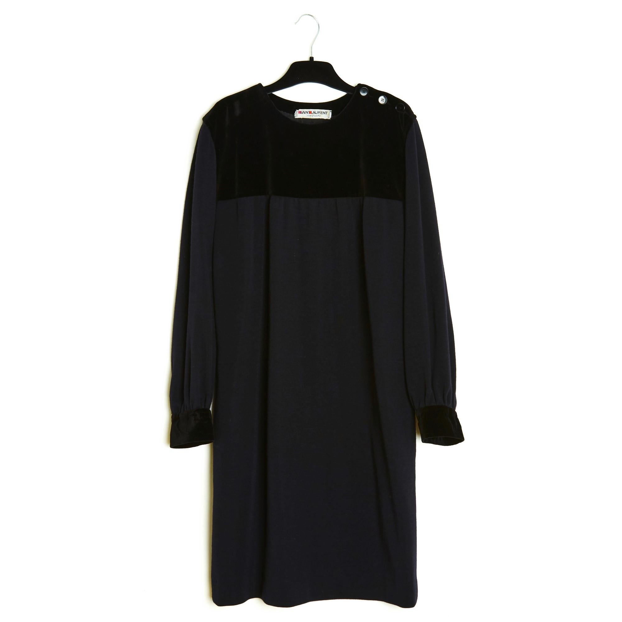 Yves Saint Laurent Rive Gauche dress in black wool jersey, round collar closed with 3 buttons on the shoulder and smooth velvet yoke on the upper bust and shoulders, straight cut with 2 slit pockets on the sides, long sleeves tightened by a velvet