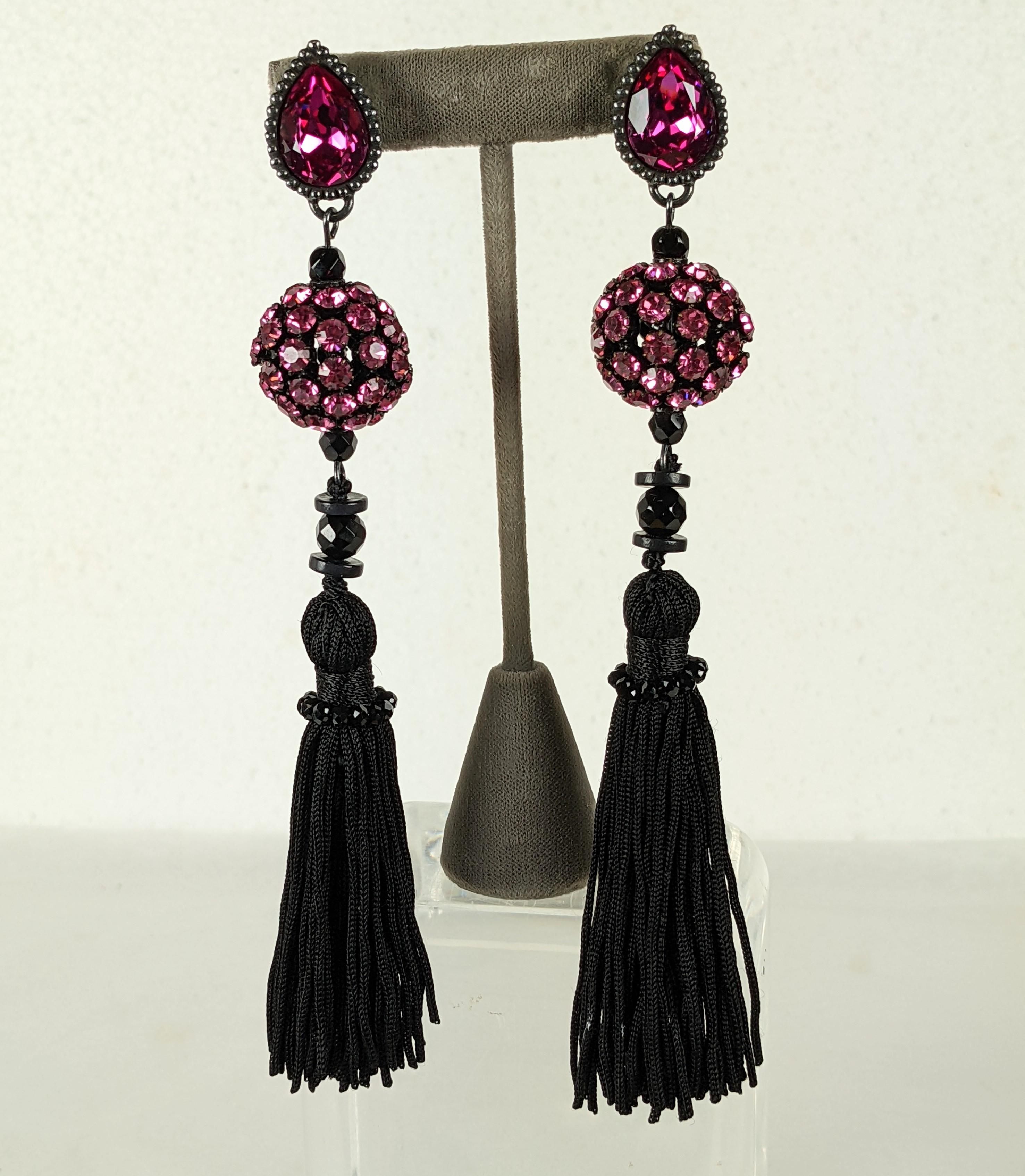 Yves Saint Laurent Rive Gauche Chinese inspired long earrings. Of fuschia and bright pink crystal rhinestones set in blackened antiqued silver and japanned metal. Long silk tassels hand sewn with minute jet beads.
Excellent Condition, Signed. L