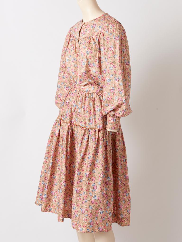 Yves Saint Laurent, Rive Gauche, liberty print,  cotton chintz, smock top and single tiered skirt ensemble in a pale nude tone, with small pastel colored, tulip like flowers. 