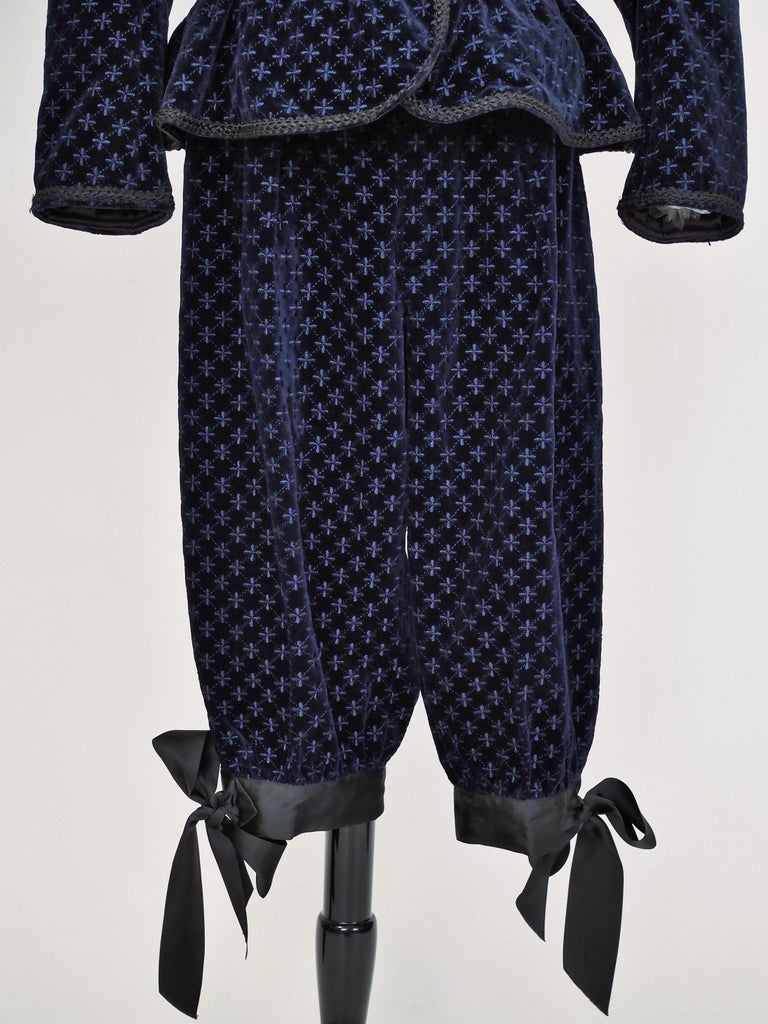 Fall-Winter 1982 collection

France

Elegant cocktail set, jacket and knickers in midnight blue velvet by Yves Saint Laurent Rive Gauche from the 1982 ready-to-wear collection. Influence of the masculine wardrobe of this doublet jacket with an