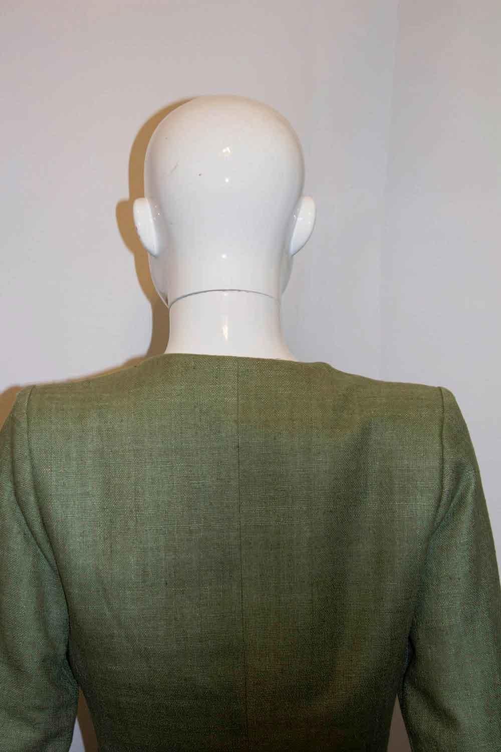 A great jacket for Spring . In a pretty green silk, this jacket by Yves Saint Laurent  Rive Gauche, has a round neckline and button front opening. Size 38 A06. Bust up to 37'', length 22''