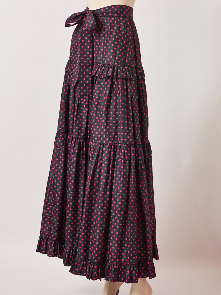 Yves Saint Laurent, Rive Gauche, maxi length, taffeta, midnight blue, with small, fuchsia polka dots, tiered peasant skirt with a gathered waist and self tie. C. 1970's.