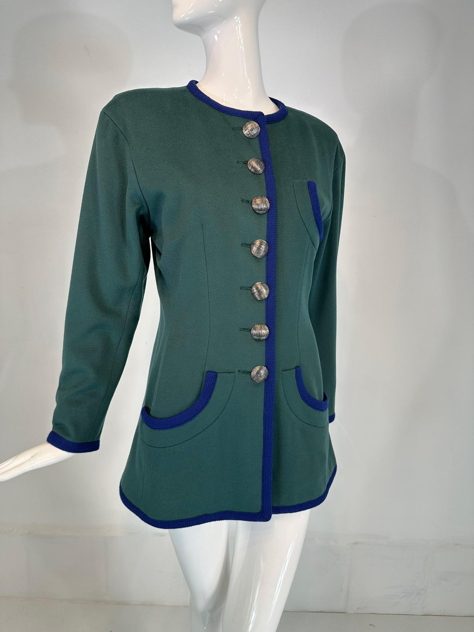 Yves Saint Laurent Rive Gauche teal blue wool jacket with bright blue woven braid trim. A beautiful jacket and a practicable addition to any wardrobe. Jewel neck jacket closes at the front with large textured silver metal buttons, there are matching