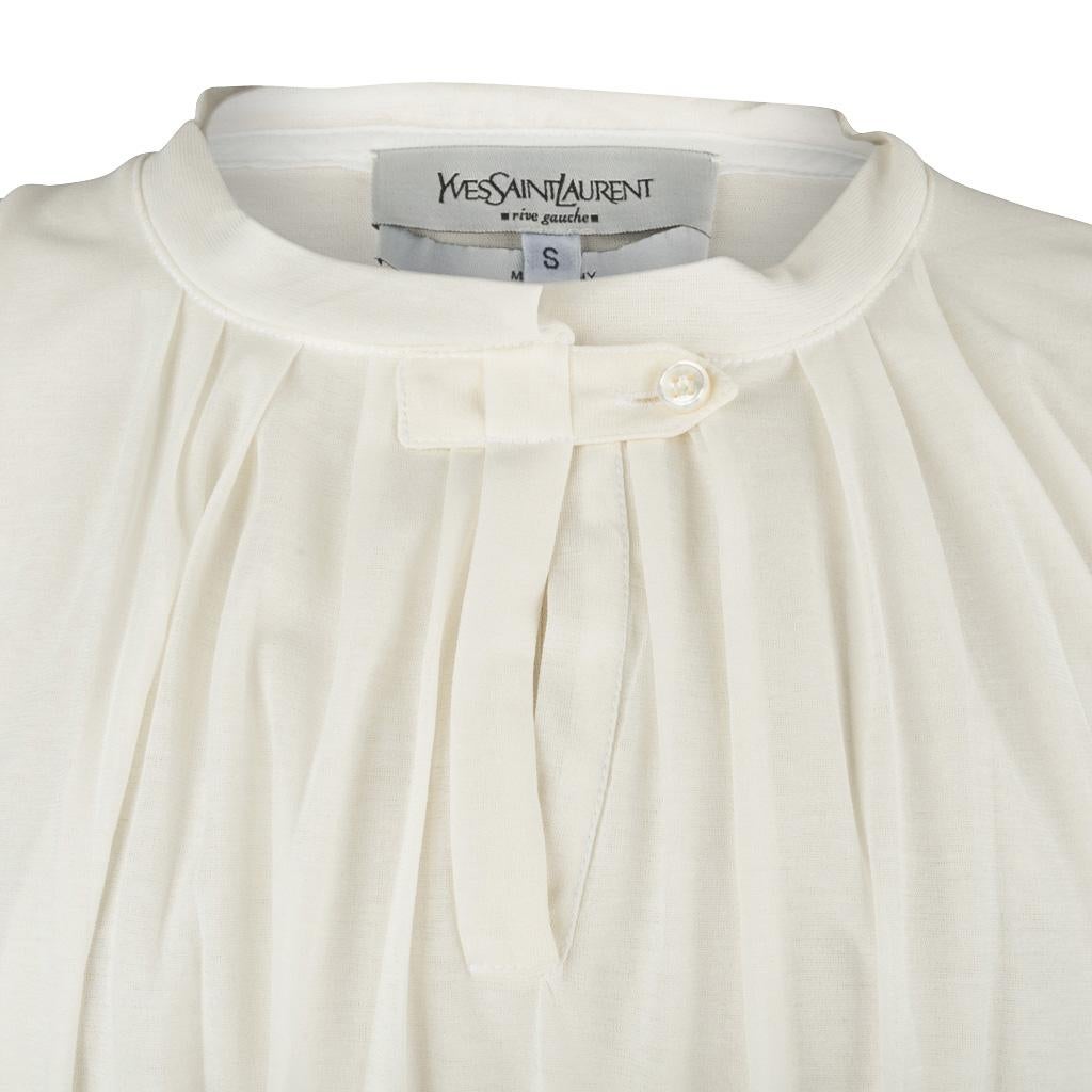 Guaranteed authentic Yves Saint Laurent Rive Gauche sleeveless cream top.
Semi sheer cotton is doubled in front and is gently pleated.
Keyhole front with tab closure.
Fabric is cotton.
final sale

SIZE S

TOP MEASURES: 
LENGTH  24.5