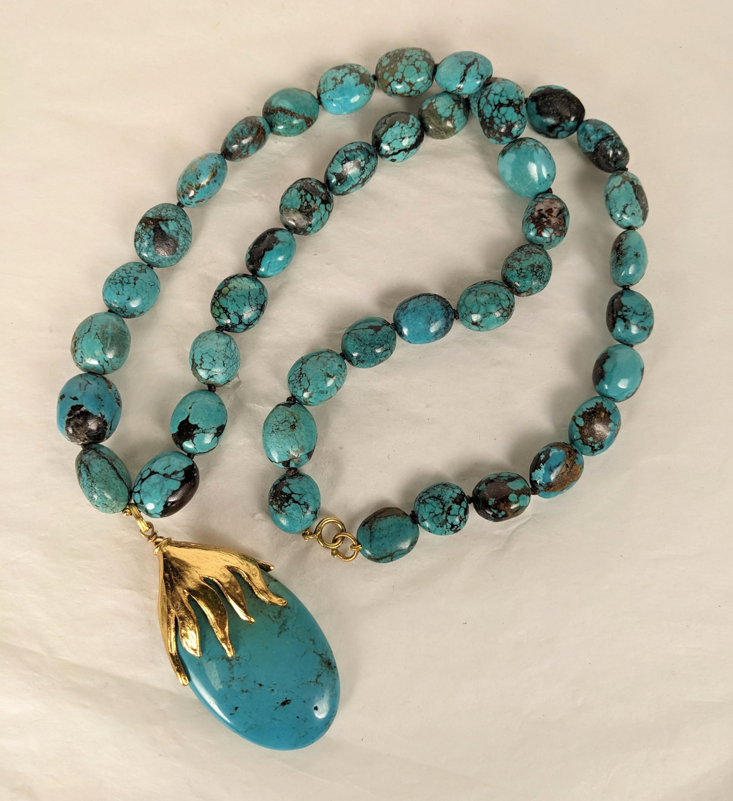 Elegant Yves Saint Laurent Rive Gauche Natural Turquoise hand knotted bead necklace with gilt Goossens bronze sunburst and turquoise pendant by Maison Goossens. Signed. 1990's France. 
Length: turquoise beads 32