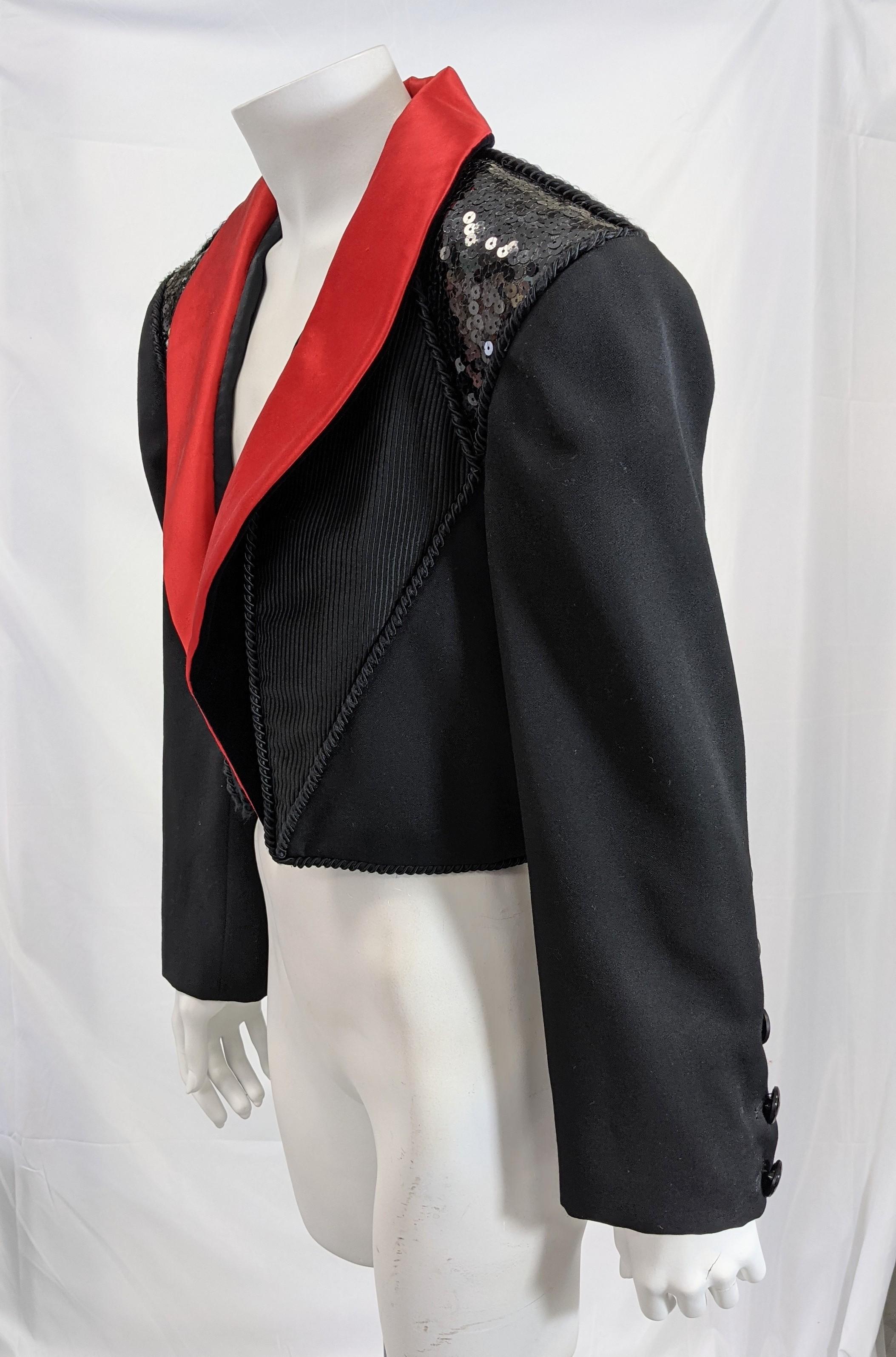 Amazing collectible Yves Saint Laurent Rive Gauche Cropped Tuxedo Jacket, 1989 of silk satin, faille, ottoman, velvet and sequins on a wool base with passementerie trim. 
Large important shoulders and a line of jet buttons up almost to elbow.
Size