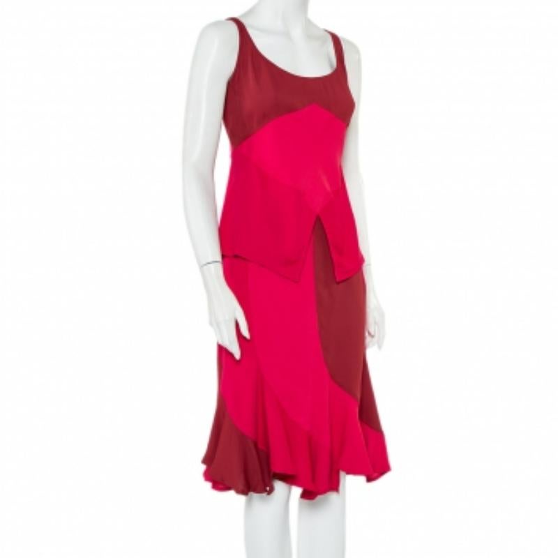 A special Vintage top and skirt set from Yves Saint Laurent's Fall 2003 line. Beautifully tailored, the set comes in a mix of stunning tones. The top is cut in a sleeveless style with a scoop neckline and V-like cuts on the hem. The matching skirt