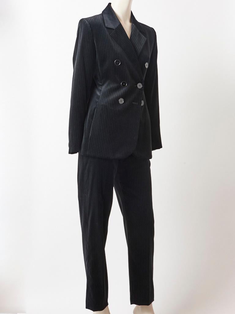 Yves Saint Laurent, Rive Gauche, black velvet, double breasted, pin stripe pantsuit having a fitted jacket with lapels,  fly front, straight leg, men's stye trouser.