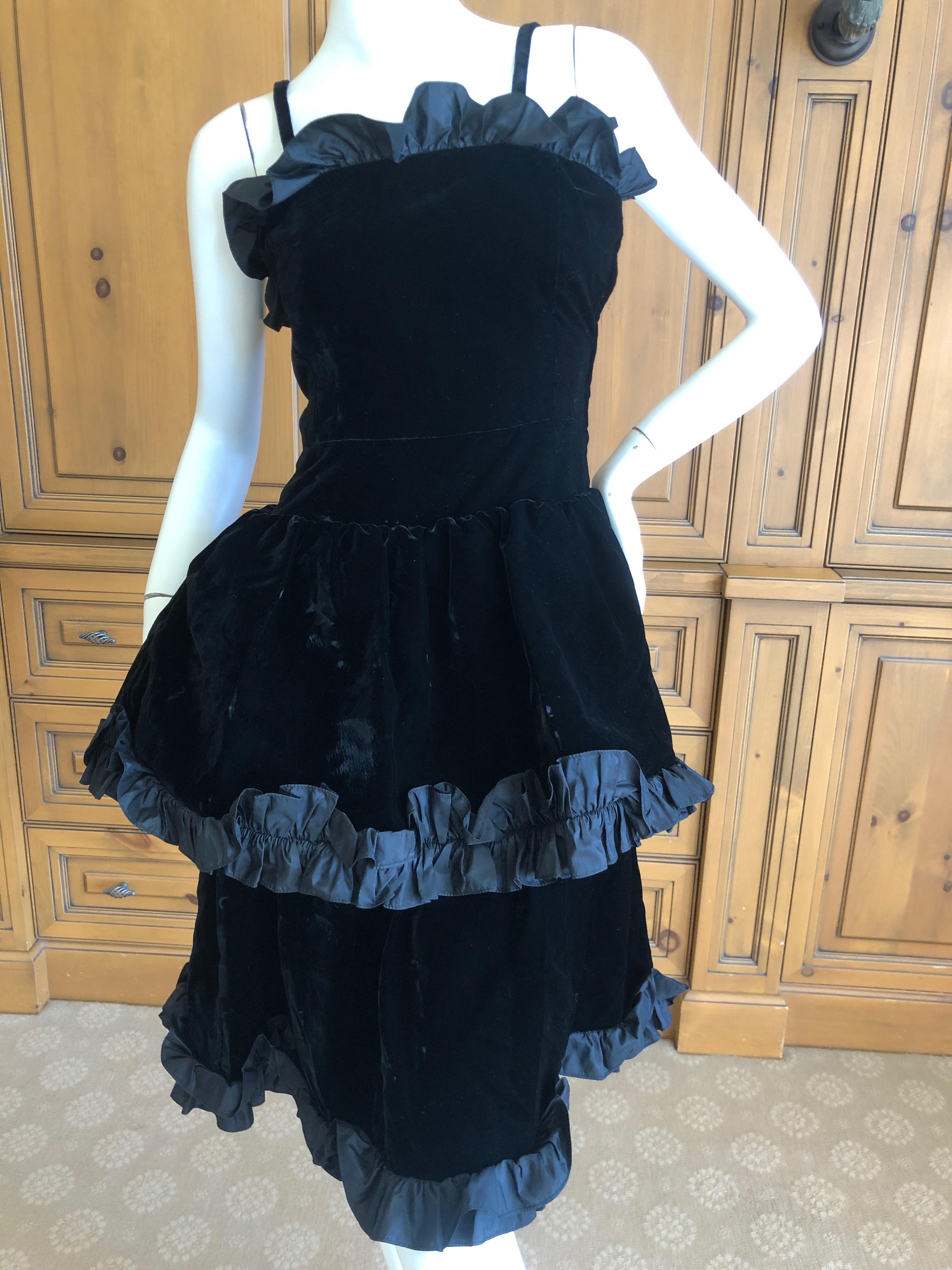 Yves Saint Laurent Rive Gauche Vintage Black Velvet Ruffle Trim Cocktail Dress.
There are two straps, but it could be worn strapless. 
I show it both ways.
Marked size 34
Bust 32