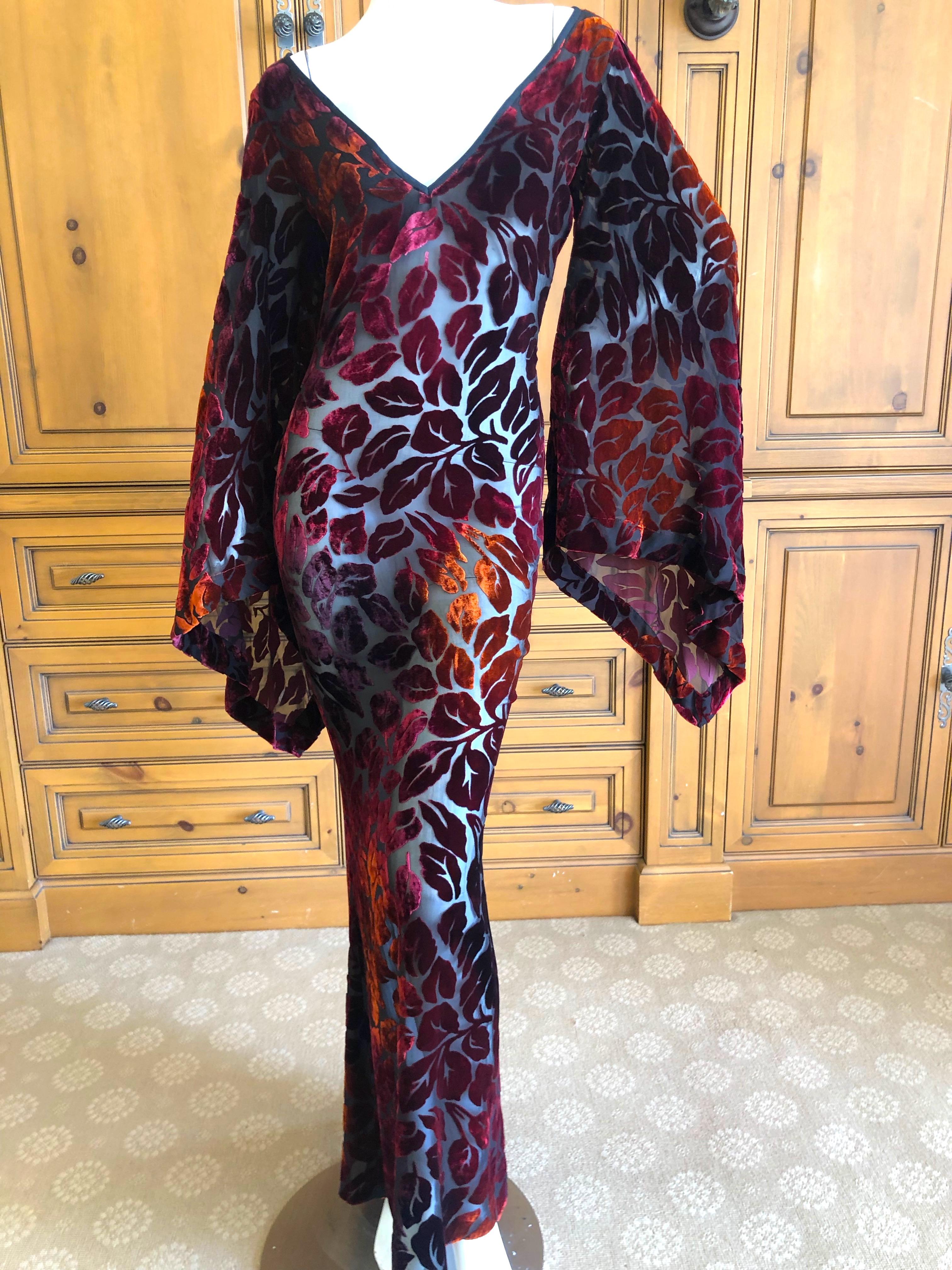 Yves Saint Laurent Rive Gauche Vintage 70's Sheer Iridescent Devore Velvet Dress.
This is so beautiful, sheer black with russet to orange velvet leaves.
Medieval  style pointed sleeves and slight pointed train.
The measurements are quite small
Size